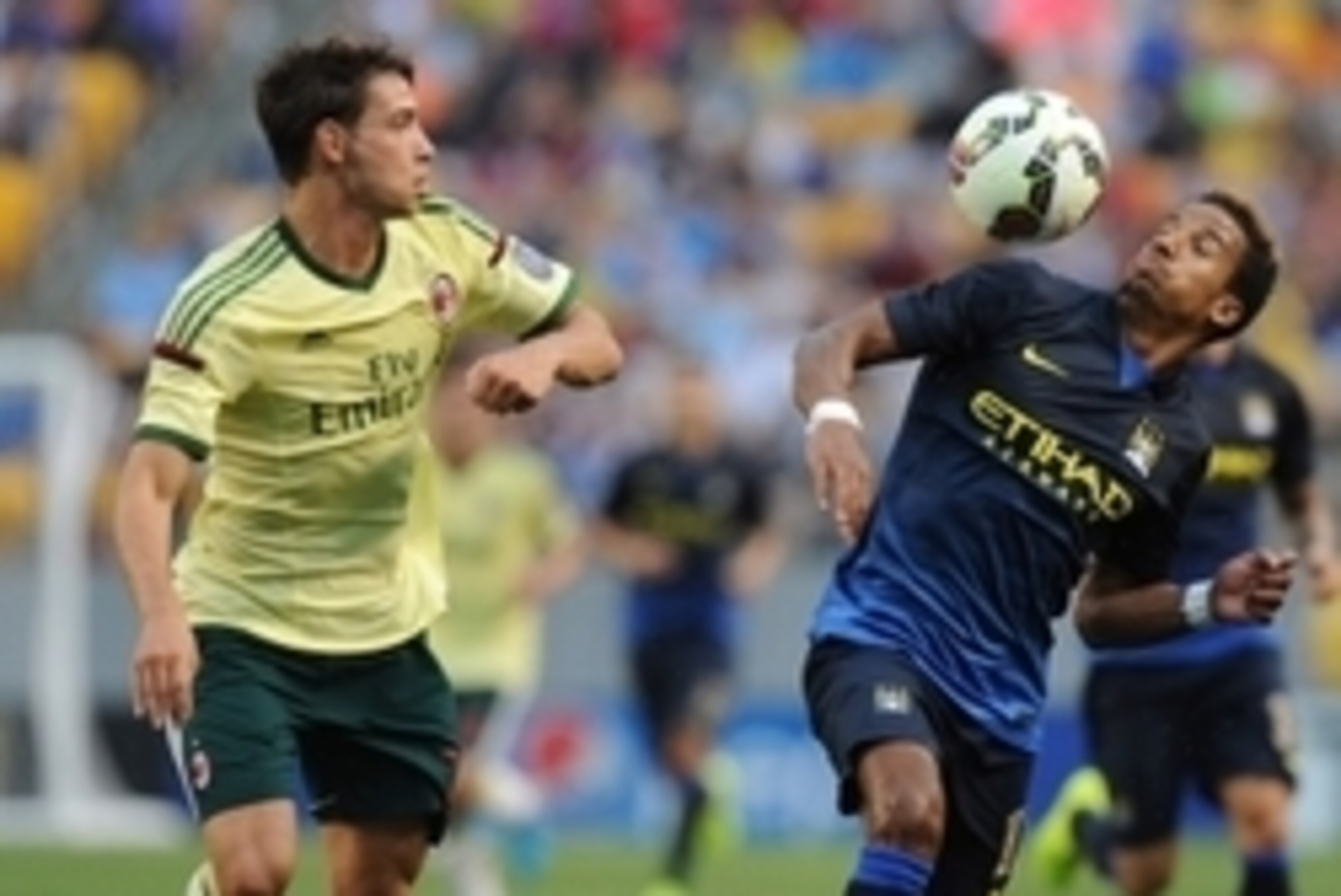 Jul 27, 2014; Pittsburgh, PA, USA; Milan defender Mattia De Sciglio (L) covers Manchester City defender Micah Richards (12) at Heinz Field. Mandatory Credit: Don Wright-USA TODAY Sports Jul 27, 2014; Pittsburgh, PA, USA; Milan defender Mattia De Sciglio (L) covers Manchester City defender Micah Richards (12) at Heinz Field. Mandatory Credit: Don Wright-USA TODAY Sports