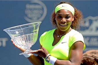 STANFORD, CA - JULY 15:  Serena Williams poses for photographers after her win over Coco Vandeweghe during the final of the Bank of the West Classic at Stanford University Taube Family Tennis Stadium on July 15, 2012 in Stanford, California.  (Photo by Ma
