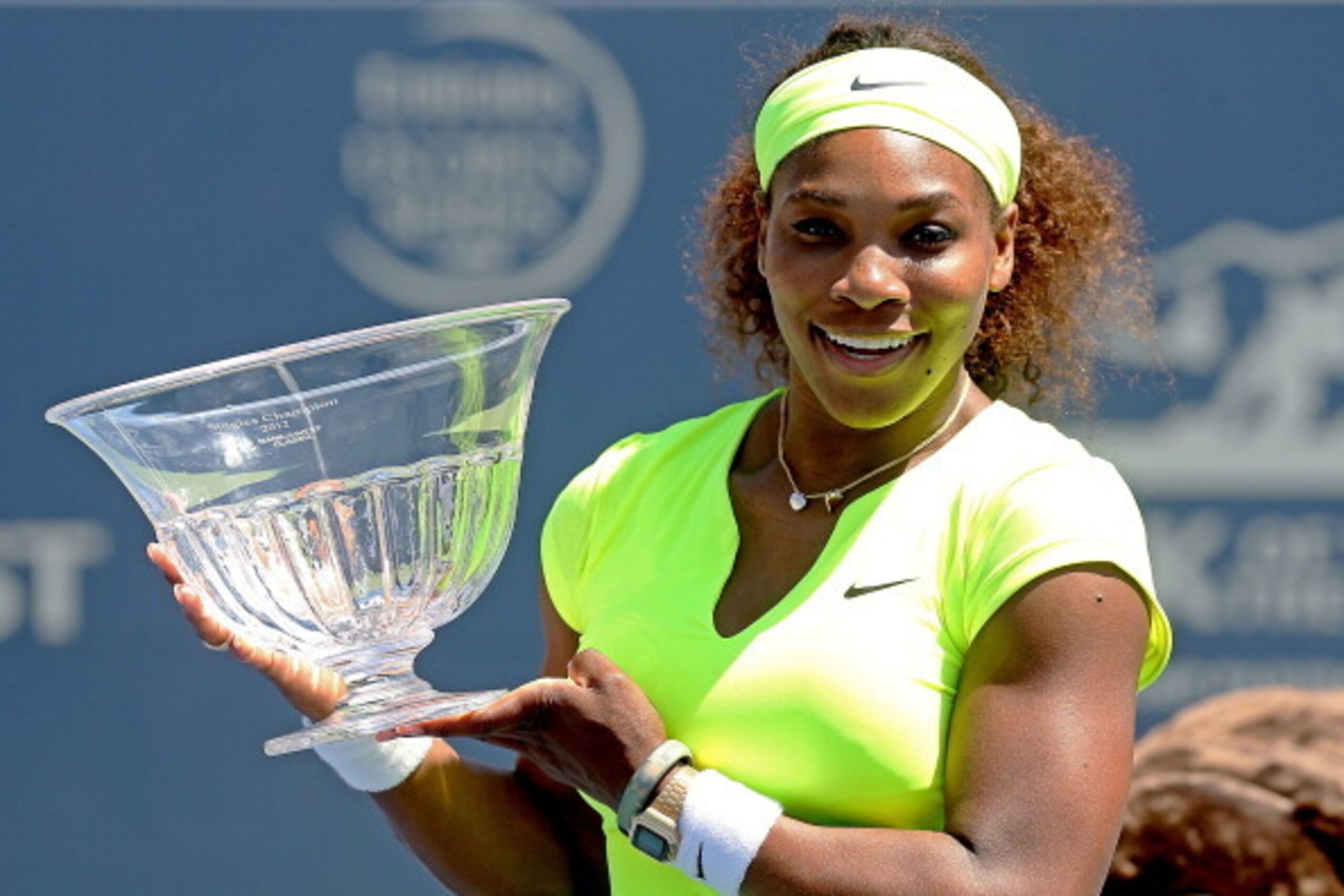 STANFORD, CA - JULY 15:  Serena Williams poses for photographers after her win over Coco Vandeweghe during the final of the Bank of the West Classic at Stanford University Taube Family Tennis Stadium on July 15, 2012 in Stanford, California.  (Photo by Ma