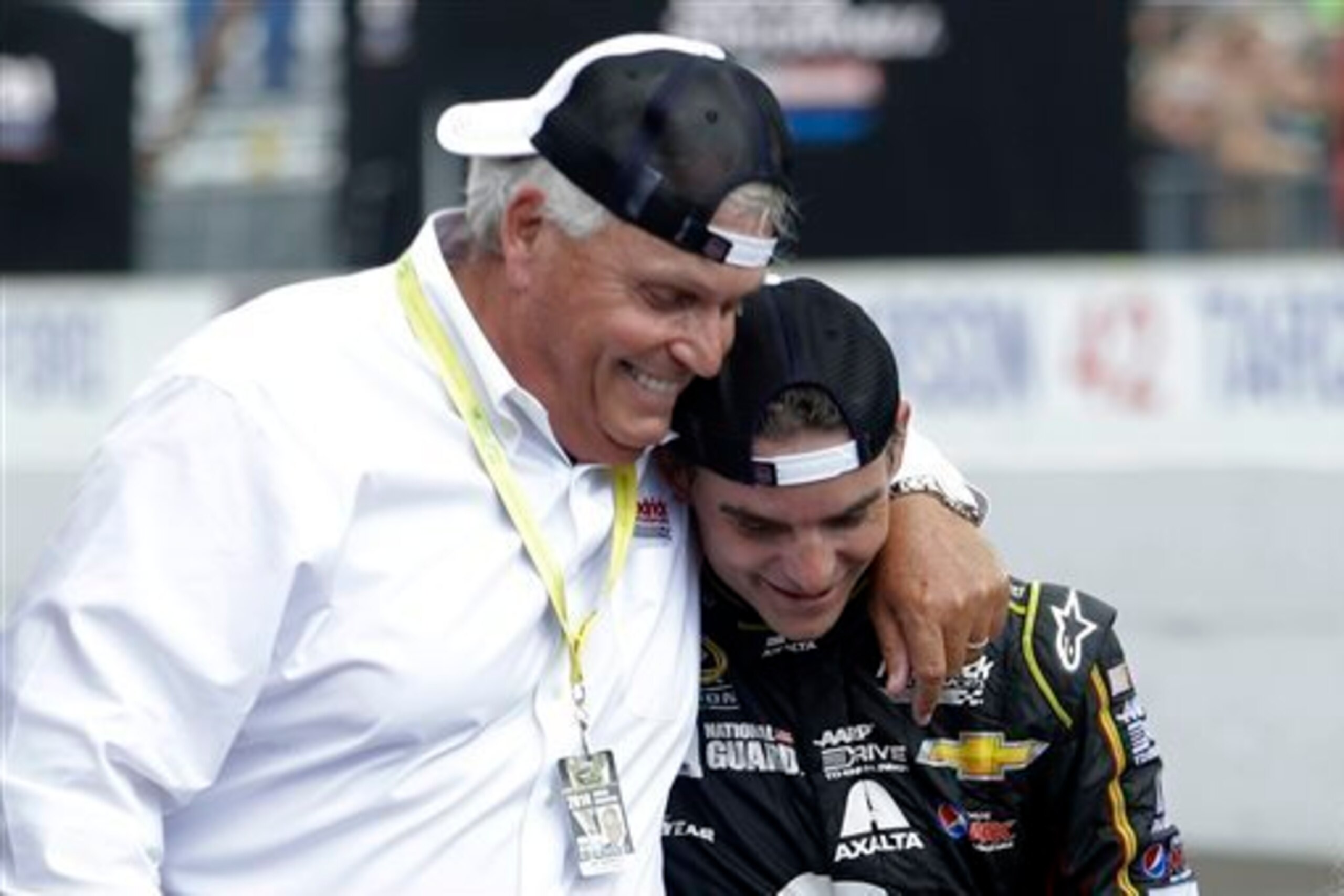 Jeff Gordon shares a moment with team owner Rick Hendrick