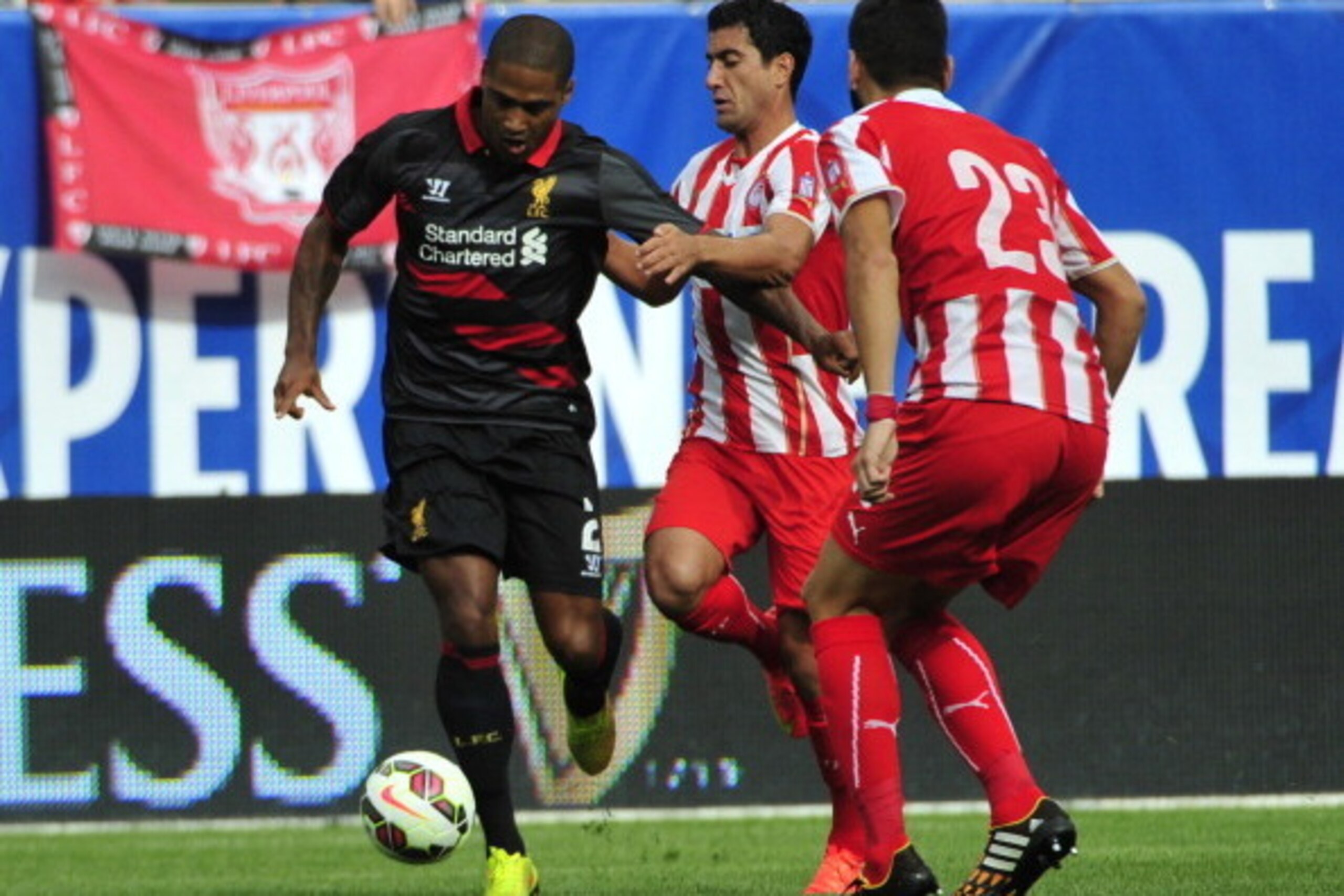 CHICAGO, IL - JULY 27:  Glen Johnson #2 of Liverpool is defended by Dimitris Siovas #23 of Olympiacos FC during the International Champions Cup 2014 on July 27, 2014 at Soldier Field in Chicago, Illinois.  (Photo by David Banks/Getty Images)