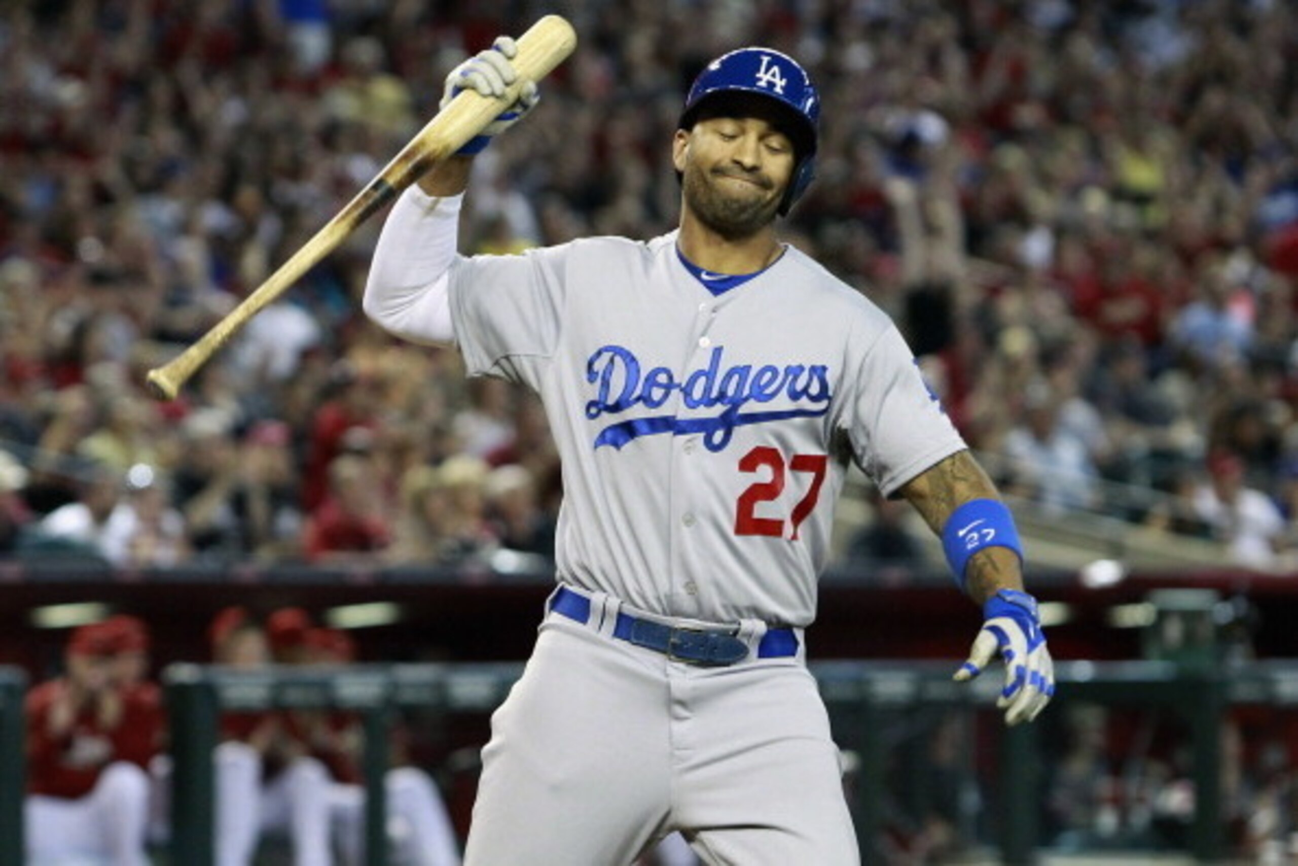 PHOENIX, AZ - MAY 18:  Matt Kemp #27 of the Los Angeles Dodgers reacts after lining out for the third out with the bases loaded against the Arizona Diamondbacks during the eighth inning of a MLB game at Chase Field on May 18, 2014 in Phoenix, Arizona.  (P