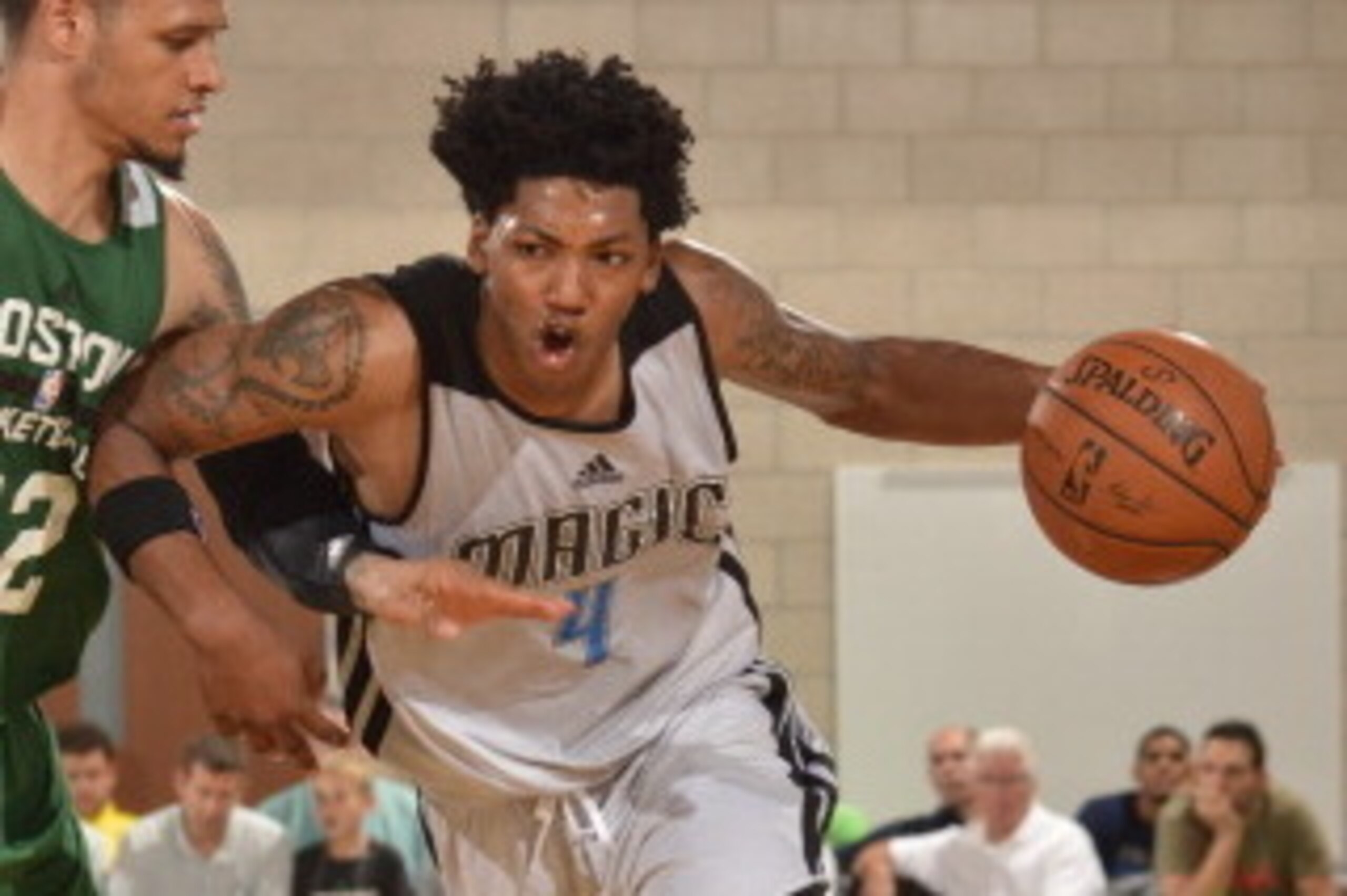 ORLANDO, FL - JULY 10: Elfrid Payton #4 of the Orlando Magic drives to the basket against the Boston Celtics during the Samsung NBA Summer League 2014 on July 10, 2014 at Amway Center in Orlando, Florida. NOTE TO USER: User expressly acknowledges and agre