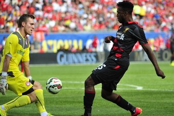 CHICAGO, IL - JULY 27: Balazs Megyeri #42 of Olympiacos FC defends Daniel Sturridge #15 of Liverpool during the International Champions Cup 2014 on July 27, 2014 at Soldier Field in Chicago, Illinois.  (Photo by David Banks/Getty Images)