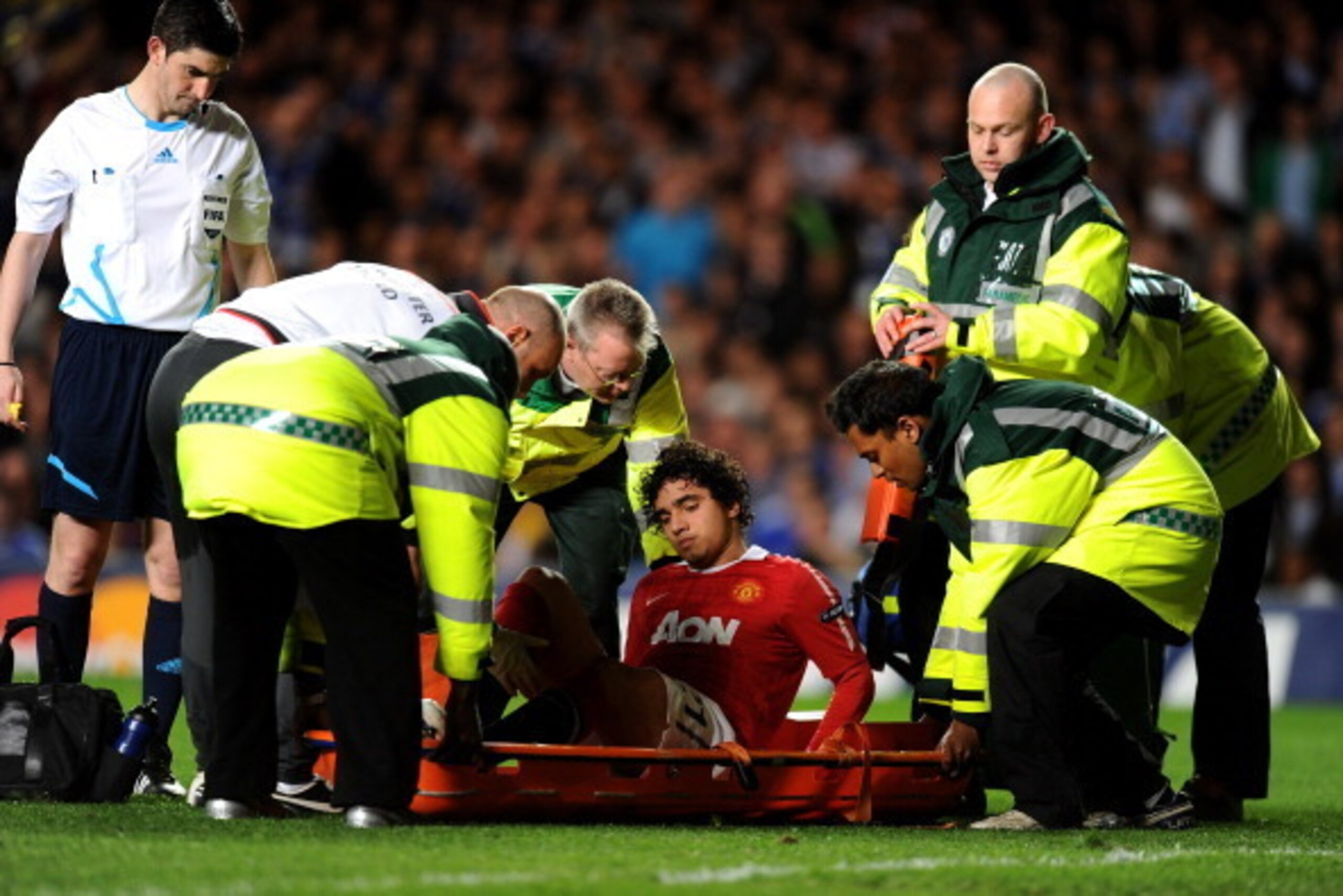 LONDON, ENGLAND - APRIL 06:  The injured Rafael of Manchester United is stretchered off the pitch during the UEFA Champions League quarter final first leg match between Chelsea and Manchester United at Stamford Bridge on April 6, 2011 in London, England. 