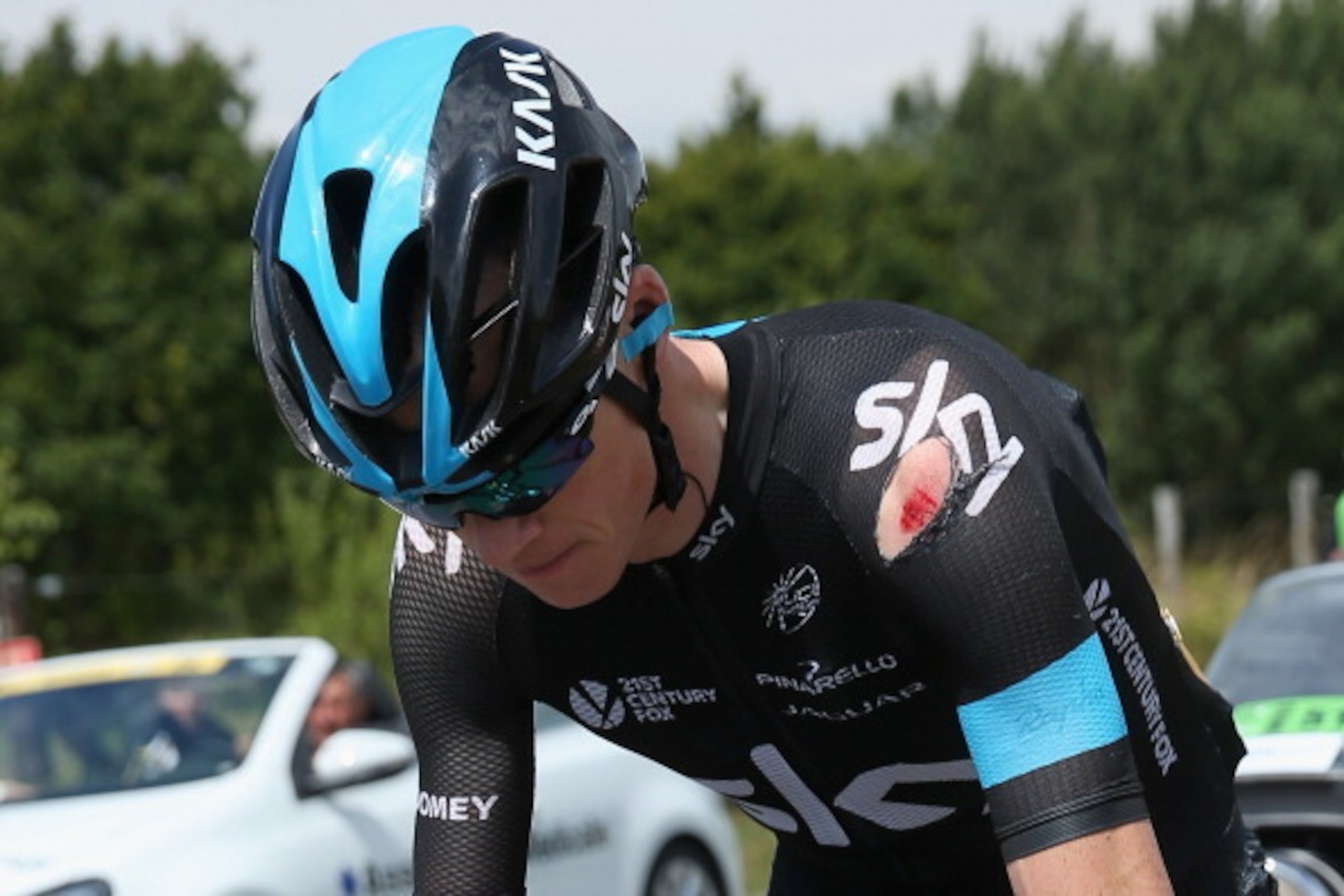 LE TOUQUET-PARIS-PLAGE, FRANCE - JULY 08:  Chris Froome of Great Britain and Team Sky chases back to the peloton after being involved in a crash just afte the start of stage four of the 2014 Le Tour de France from Le Touquet-Paris-Plage to Lille on July 8