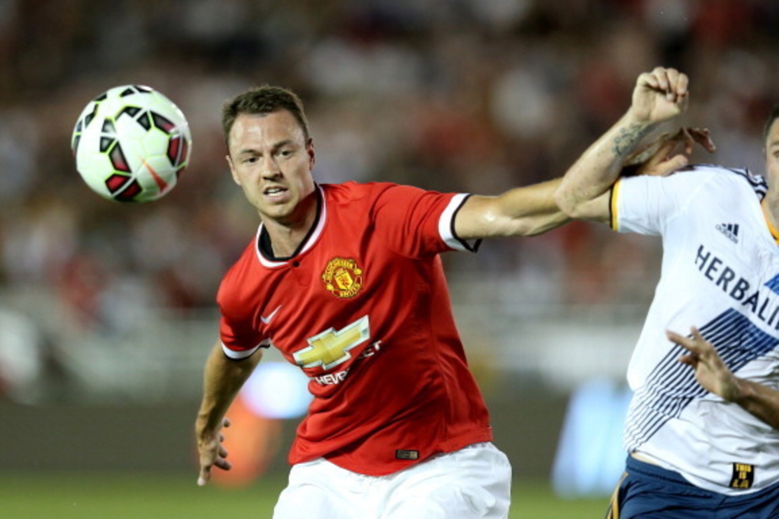 PASADENA, CA - JULY 23:  Jonny Evans #6 of Manchester United fights for the ball with Robbie Keane #7 of the Los Angeles Galaxy at the Rose Bowl on July 23, 2014 in Pasadena, California.  (Photo by Stephen Dunn/Getty Images)