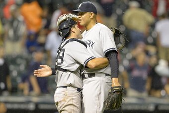 CLEVELAND, OH - JULY 7:  Catcher Francisco Cervelli #29 celebrates with closing pitcher Dellin Betances #68 of the New York Yankees after the Yankees defeated the Cleveland Indians at Progressive Field on July 7, 2014 in Cleveland, Ohio. The Yankees defea