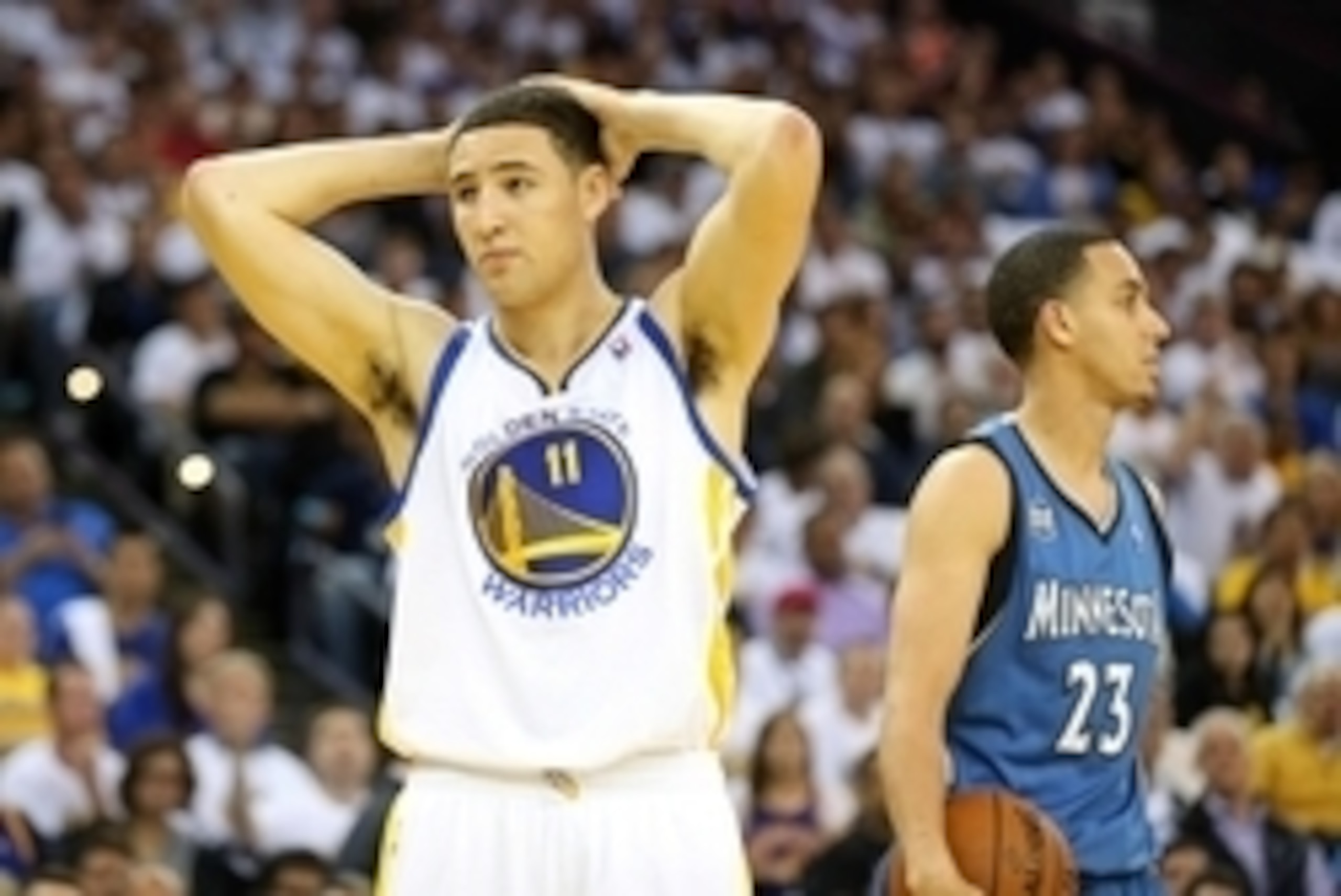 Apr 14, 2014; Oakland, CA, USA; Golden State Warriors guard Klay Thompson (11) reacts after being called for a foul against Minnesota Timberwolves guard Kevin Martin (23) during the second quarter at Oracle Arena. Mandatory Credit: Kelley L Cox-USA TODAY 