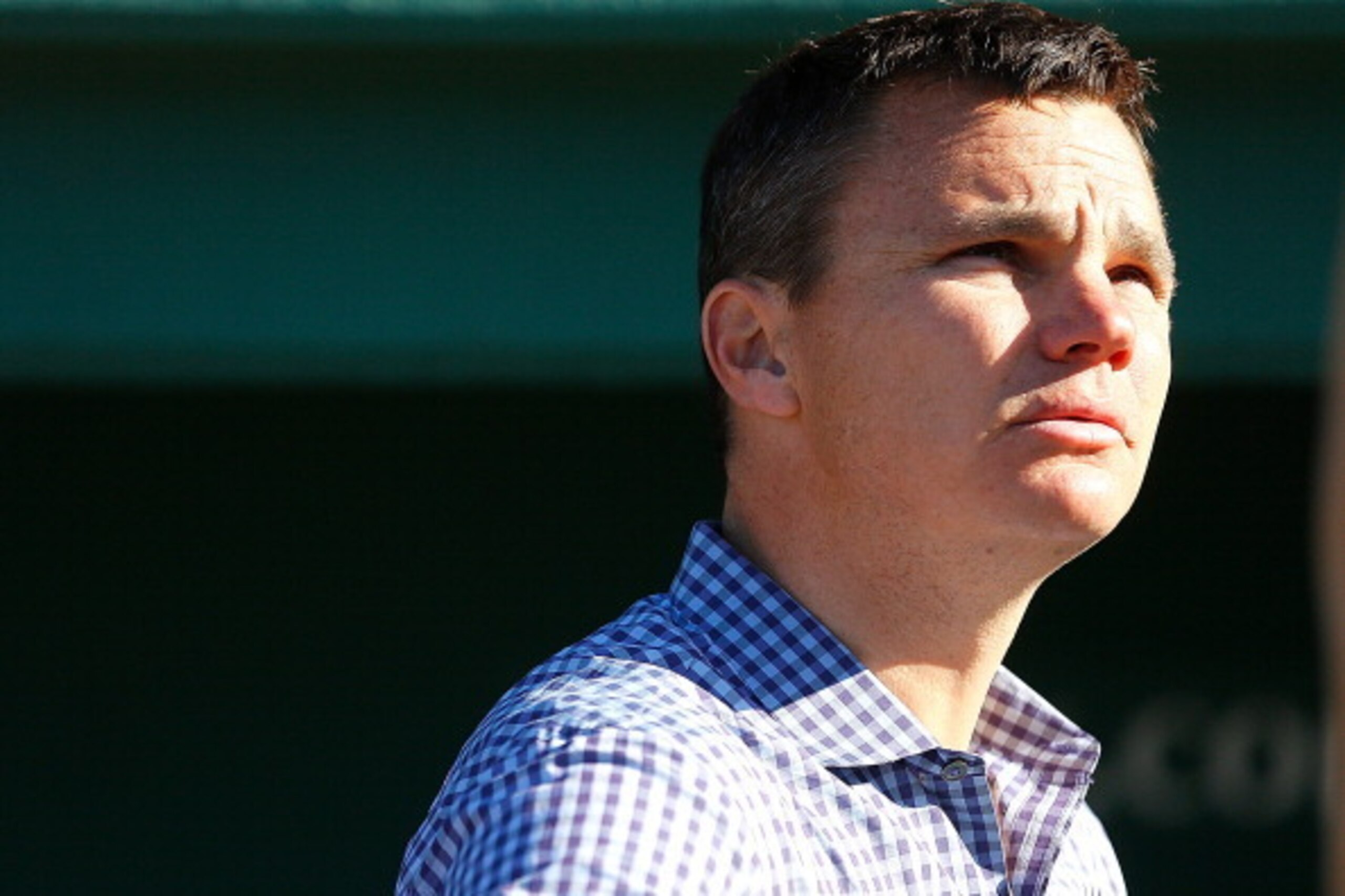 BOSTON, MA - MAY 6:  Ben Cherington, general manager of the Boston Red Sox, watches batting practice from a the dugout before a game with the Minnesota Twins at Fenway Park on May 6, 2013 in Boston, Massachusetts.  (Photo by Jim Rogash/Getty Images)