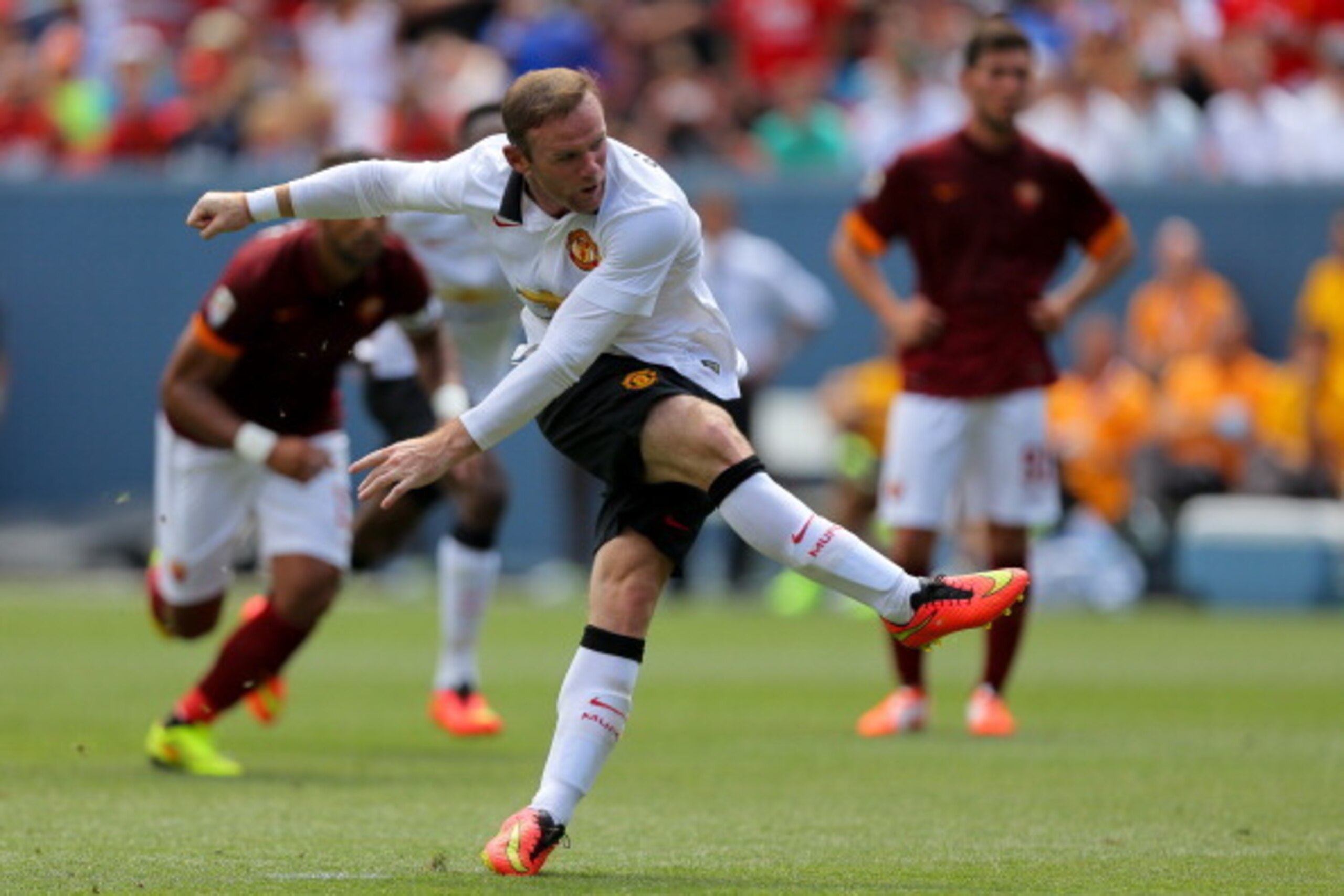 DENVER, CO - JULY 26: Wayne Rooney #10 of Manchester United follows through on a penalty goal during the first half of an International Champions Cup match against AS Roma at Sports Authority Field at Mile High on July 26, 2014 in Denver, Colorado. (Photo