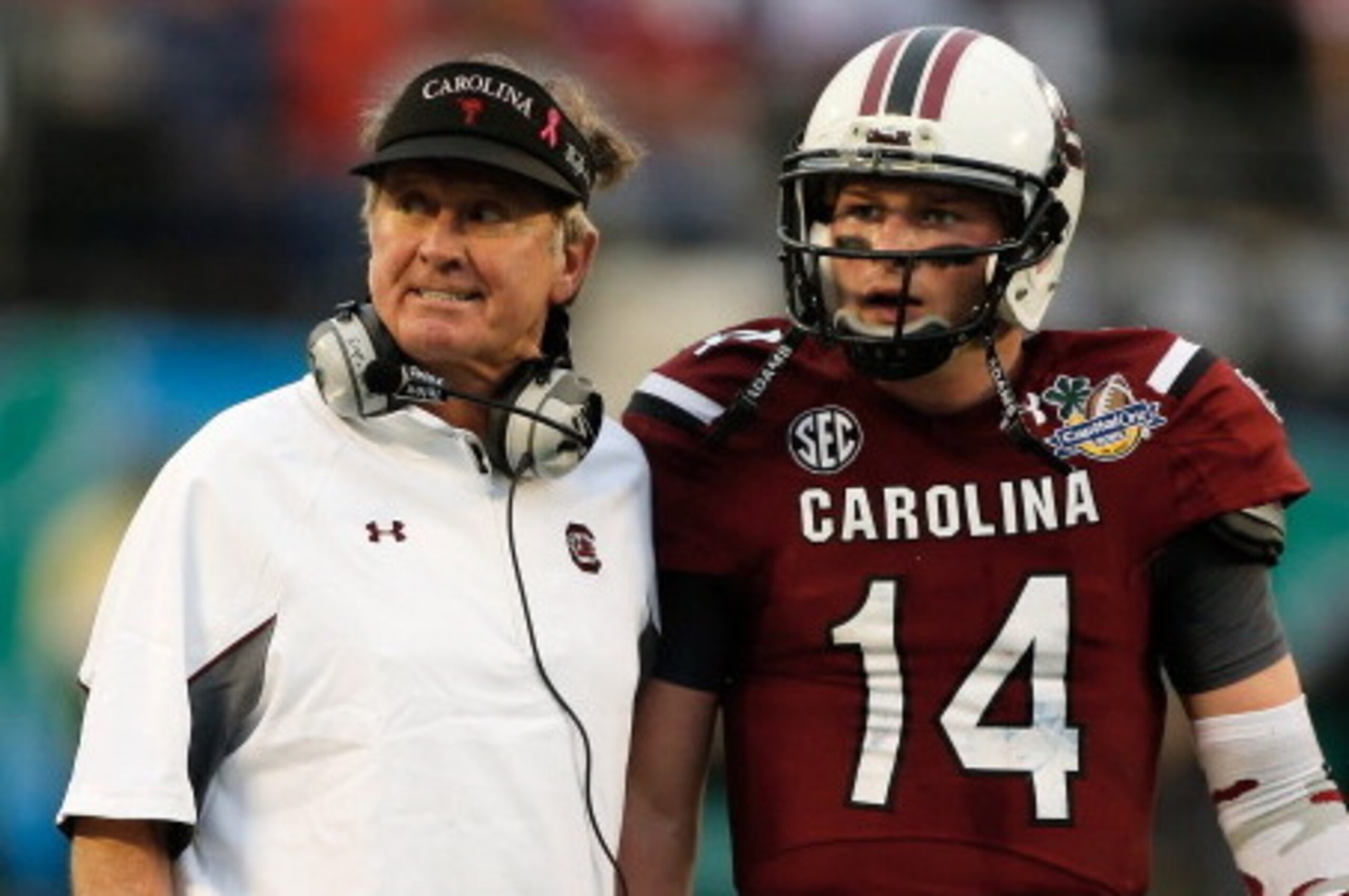 ORLANDO, FL - JANUARY 01: Head coach Steve Spurrier of the South Carolina Gamecocks chats with his quarterback Connor Shaw #14 in the second half of their game against the Wisconsin Badgers at the Capital One Bowl on January 1, 2014 in Orlando, Florida. ORLANDO, FL - JANUARY 01: Head coach Steve Spurrier of the South Carolina Gamecocks chats with his quarterback Connor Shaw #14 in the second half of their game against the Wisconsin Badgers at the Capital One Bowl on January 1, 2014 in Orlando, Florida.
