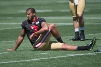 July 24, 2014; Santa Clara, CA, USA; San Francisco 49ers quarterback Colin Kaepernick (7) stretches during training camp at the SAP Performance Facility. Mandatory Credit: Kyle Terada-USA TODAY Sports