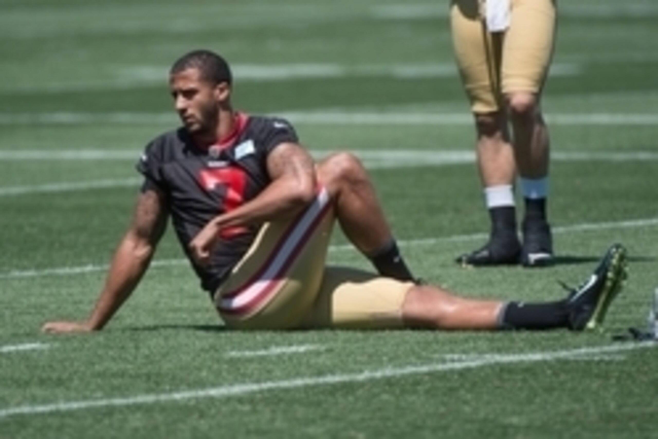 July 24, 2014; Santa Clara, CA, USA; San Francisco 49ers quarterback Colin Kaepernick (7) stretches during training camp at the SAP Performance Facility. Mandatory Credit: Kyle Terada-USA TODAY Sports