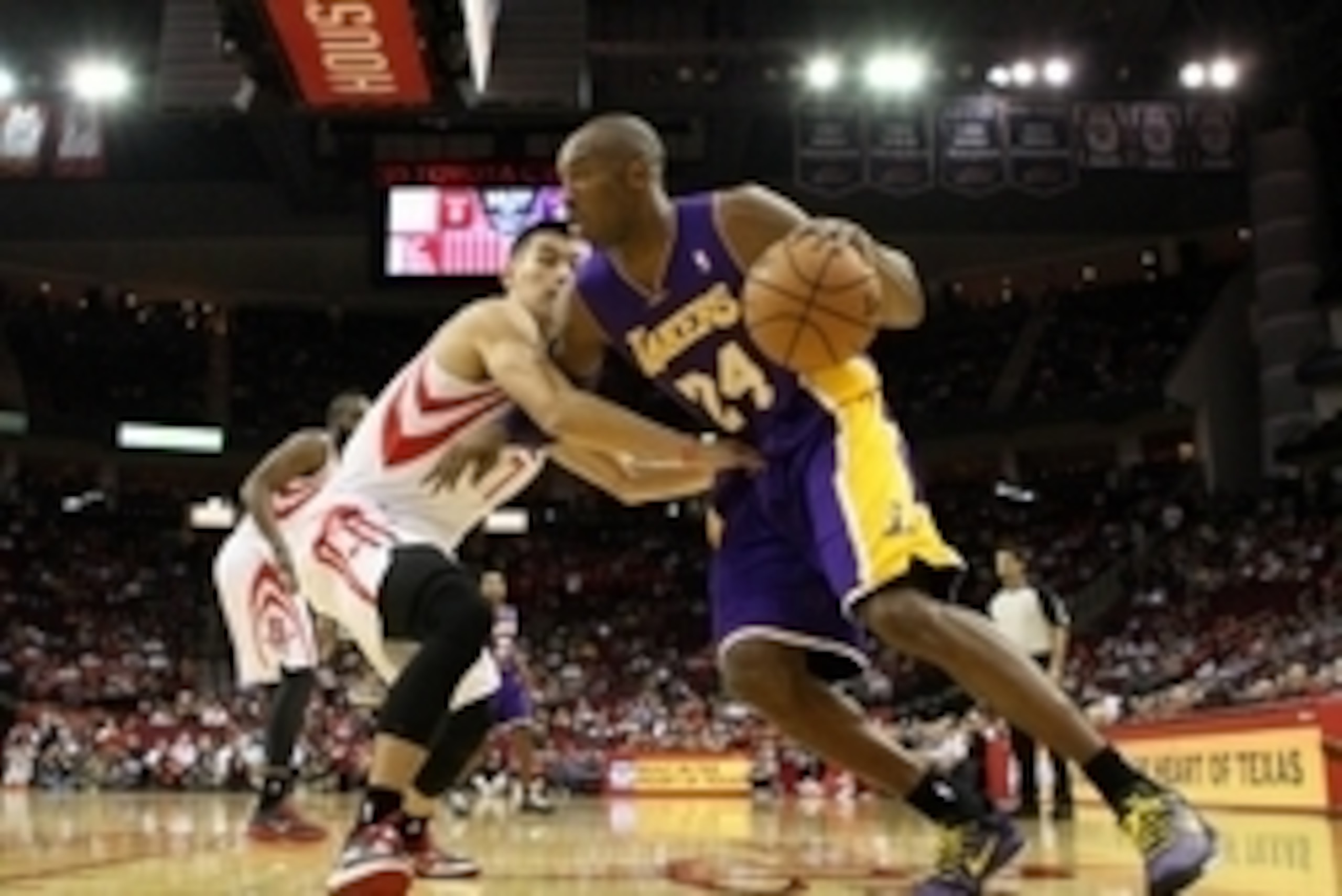 Dec 4, 2012; Houston, TX, USA; Los Angeles Lakers shooting guard Kobe Bryant (24) drives the ball during the first quarter as Houston Rockets point guard Jeremy Lin (7) defends at Toyota Center. Mandatory Credit: Troy Taormina-USA TODAY Sports