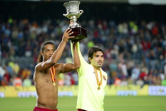 BARCELONA, SPAIN - AUGUST 20: Ronaldinho and Deco of FC Barcelona are seen with the trophy after winning the match between FC Barcelona and Real Betis during the Spain Supercup Final on August 20, 2005 at Camp Nou stadium in Barcelona, Spain.  (Photo by L