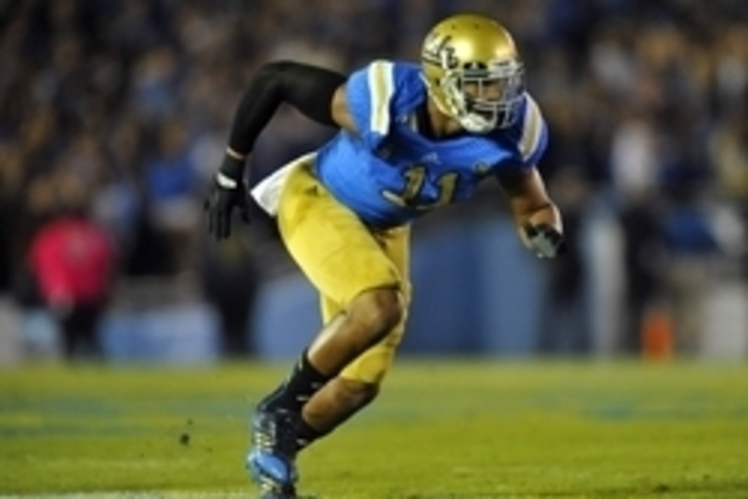 October 12, 2013; Pasadena, CA, USA; UCLA Bruins linebacker Anthony Barr (11) defends against the California Golden Bears during the first half at the Rose Bowl. Mandatory Credit: Gary A. Vasquez-USA TODAY Sports