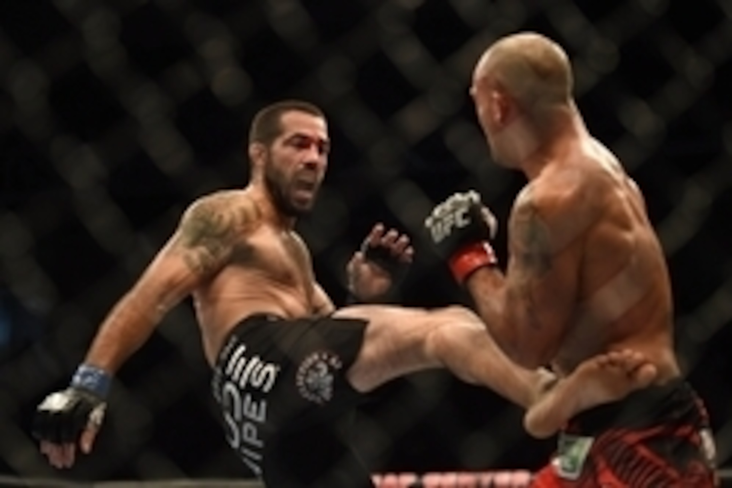 July 26, 2014; San Jose, CA, USA; Robbie Lawler (red gloves) defends against Matt Brown (blue gloves) during the welterweight bout of the FOX UFC Saturday at SAP Center. Mandatory Credit: Kyle Terada-USA TODAY Sports