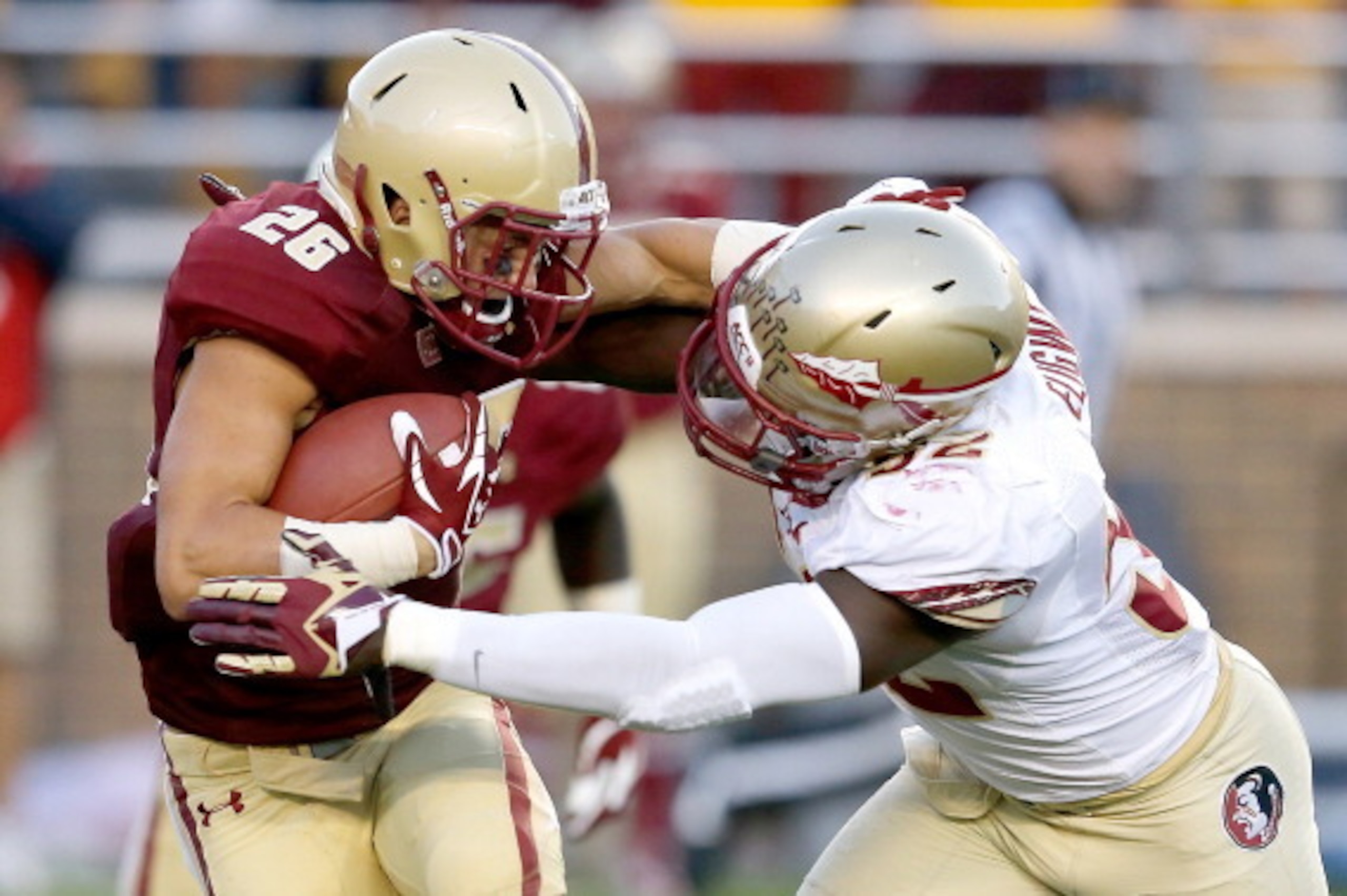 CHESTNUT HILL, MA - SEPTEMBER 28: Ukeme Eligwe #52 of the Florida State Seminoles stops David Dudeck #26 of the Boston College Eagles in the second half at Alumni Stadium on September 28, 2013 in Chestnut Hill, Massachusetts. (Photo by Jim Rogash/Getty Im