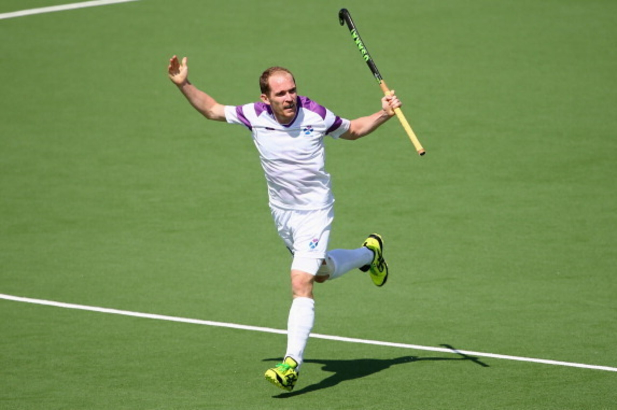 GLASGOW, SCOTLAND - JULY 28: Gordon McIntyre of Scotland celebrates after scoring a goal during the Men's preliminaries match between Scotland and Wales at Glasgow National Hockey Centre during day five of the Glasgow 2014 Commonwealth Games on July 28, 2