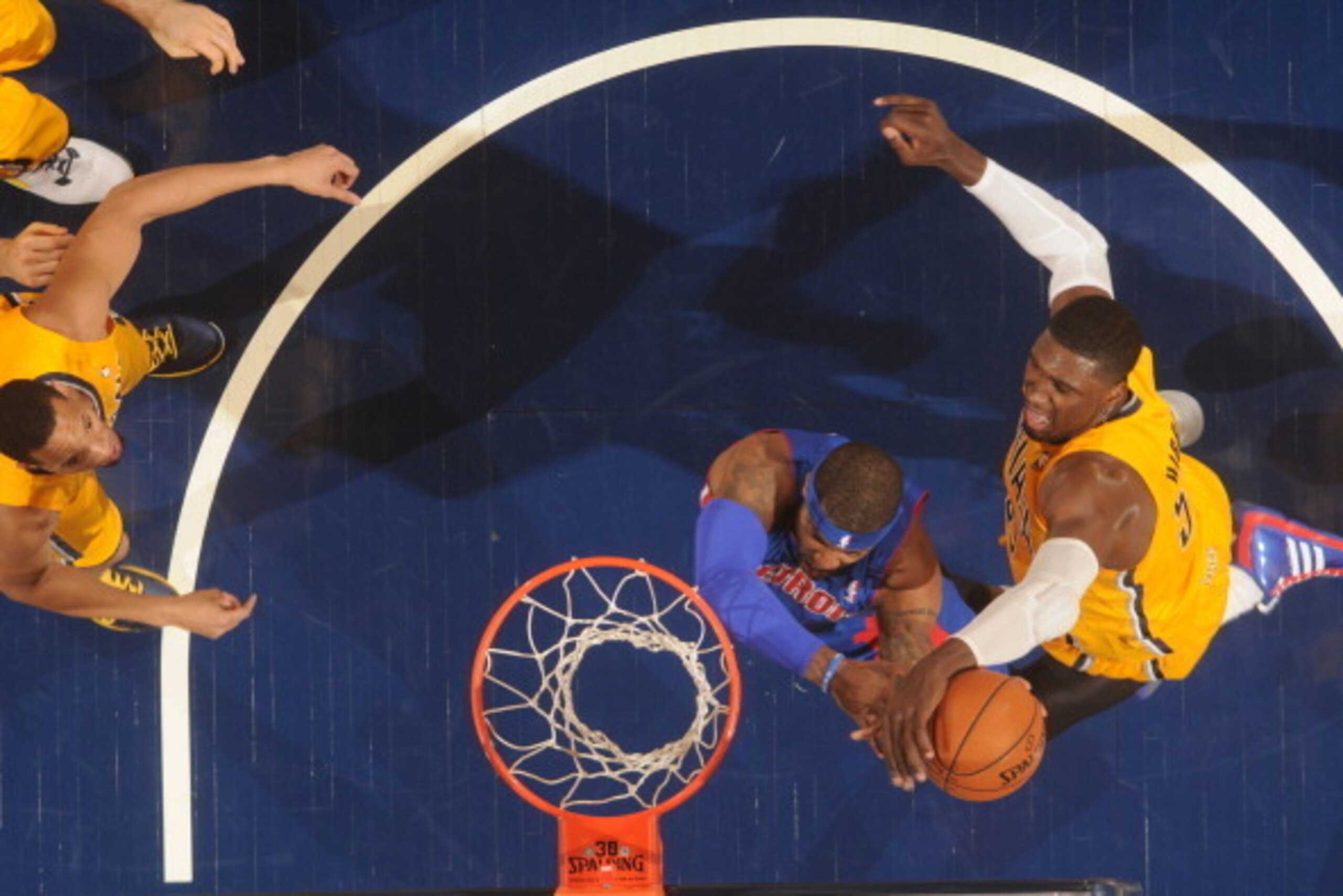INDIANAPOLIS - APRIL 2: Roy Hibbert #55 of the Indiana Pacers blocks a shot against Josh Smith #6 of the Detroit Pistons at Bankers Life Fieldhouse on April 2, 2014 in Indianapolis, Indiana.  NOTE TO USER: User expressly acknowledges and agrees that, by d