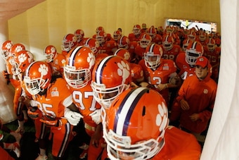 MIAMI GARDENS, FL - JANUARY 04:  The Clemson Tigers walk out of the tunnel onto the field against the West Virginia Mountaineers during the Discover Orange Bowl at Sun Life Stadium on January 4, 2012 in Miami Gardens, Florida.  (Photo by Mike Ehrmann/Gett
