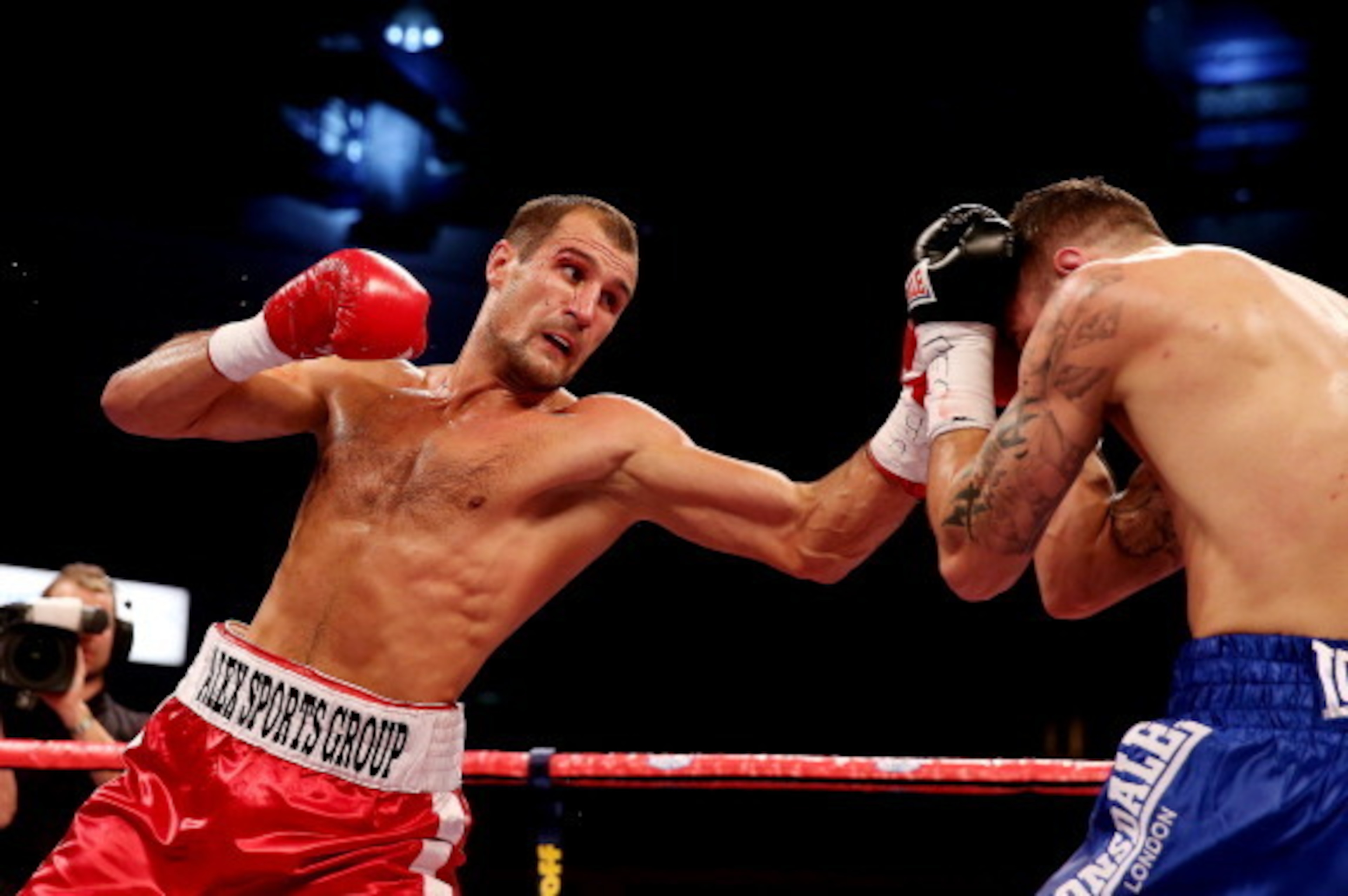 CARDIFF, WALES - AUGUST 17:  Nathan Cleverly (R) in action against Sergey Kovalev during the WBO World Light-Heavyweight Championship bout at Motorpoint Arena on August 17, 2013 in Cardiff, Wales.  (Photo by Scott Heavey/Getty Images)