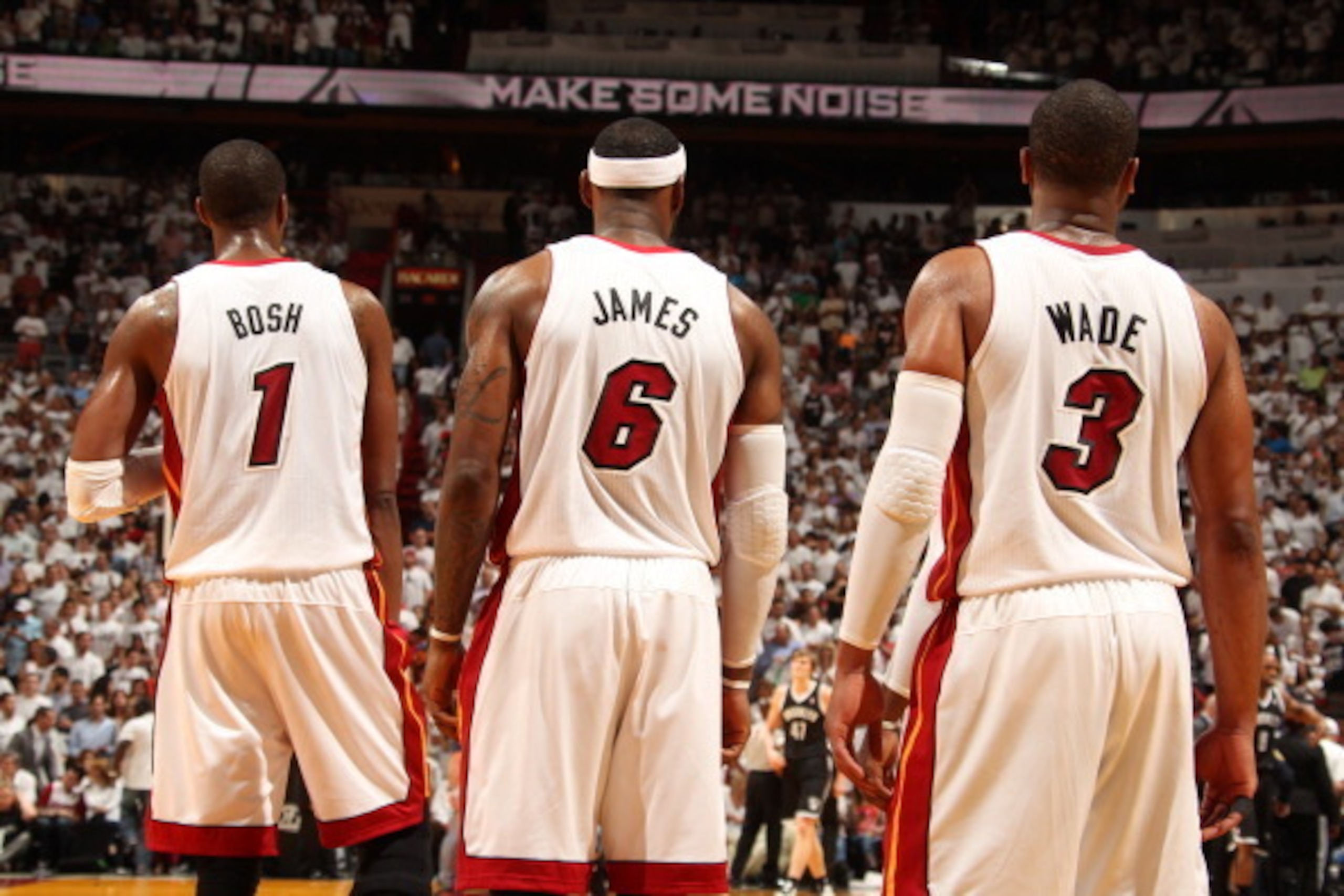 MIAMI, FL - MAY 14: Chris Bosh #1, LeBron James #6, and Dwyane Wade #3 of the Miami Heat stand in Game Five of the Eastern Conference Semifinals against the Brooklyn Nets during the 2014 NBA playoffs at American Airlines Arena in Miami, Florida on May 14,