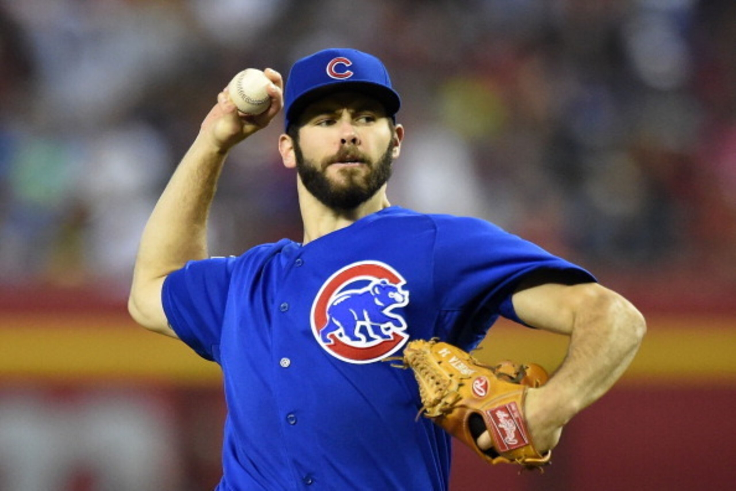 PHOENIX, AZ - JULY 20:  Jake Arrieta #49 of the Chicago Cubs delivers a first inning pitch against the Arizona Diamondbacks at Chase Field on July 20, 2014 in Phoenix, Arizona.  (Photo by Norm Hall/Getty Images)