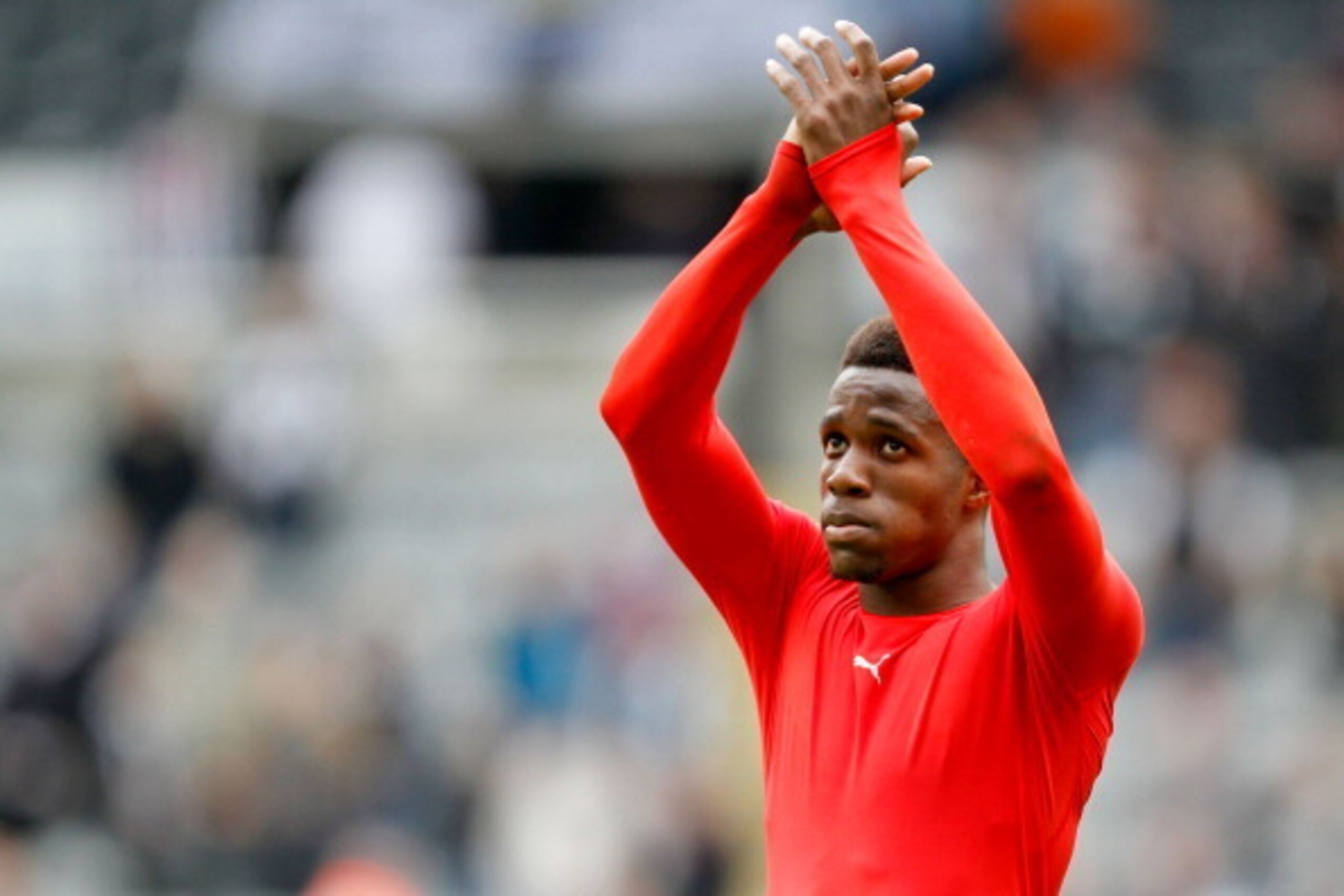 NEWCASTLE, ENGLAND- May 03: Cardiff City's Wilfried Zaha after Cardiff city are relegated during the Barclays Premier League match between Newcastle United and Cardiff City at St. James' Park on May 03, 2014 in Newcastle upon Tyne, England. (Photo by R NEWCASTLE, ENGLAND- May 03: Cardiff City's Wilfried Zaha after Cardiff city are relegated during the Barclays Premier League match between Newcastle United and Cardiff City at St. James' Park on May 03, 2014 in Newcastle upon Tyne, England. (Photo by R