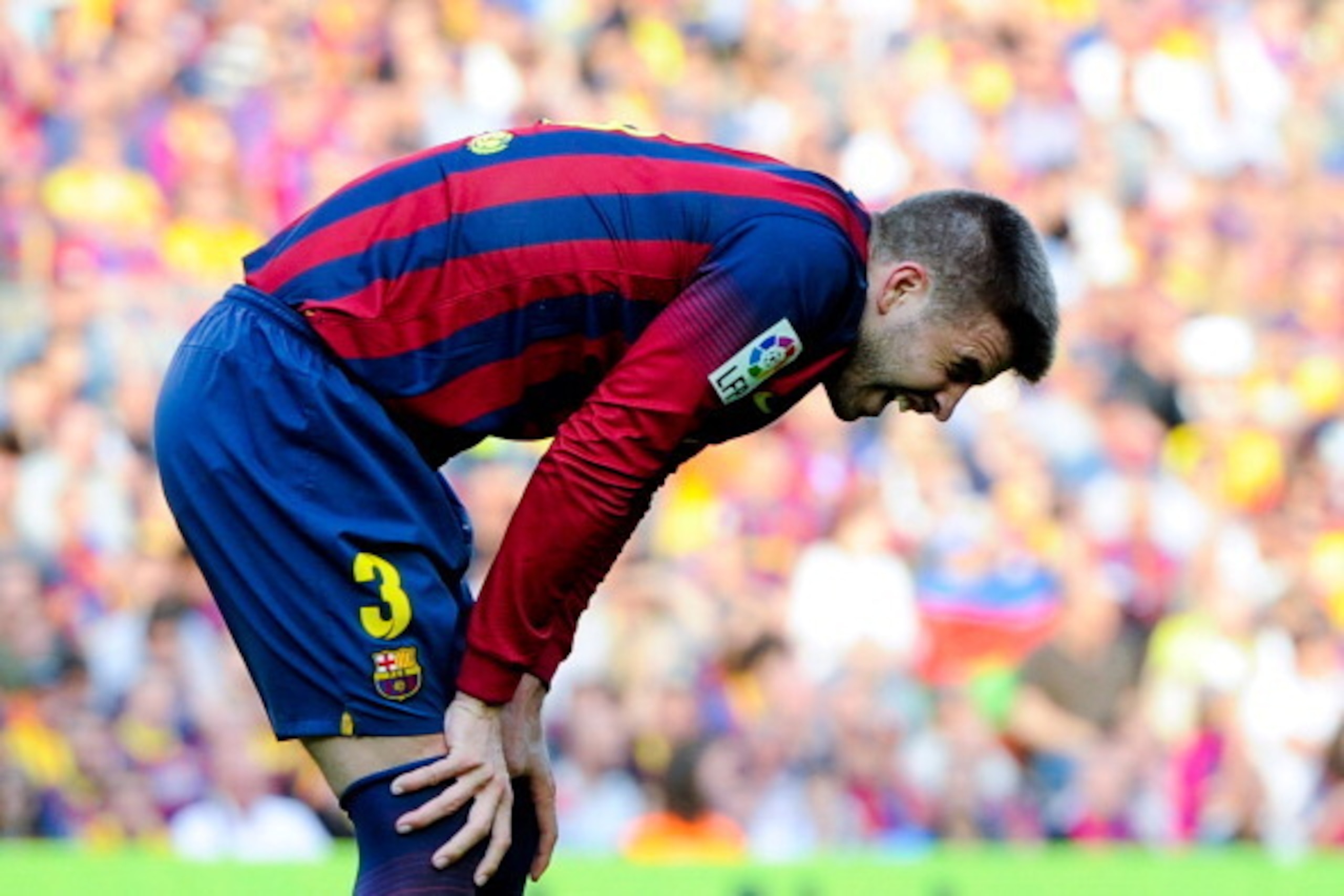 BARCELONA, SPAIN - MAY 17:  Gerard Pique of FC Barcelona reacts dejected during the La Liga match between FC Barcelona and Club Atletico de Madrid at Camp Nou on May 17, 2014 in Barcelona, Spain. Atletico the Madrid won the Spanish league La Liga.  (Photo