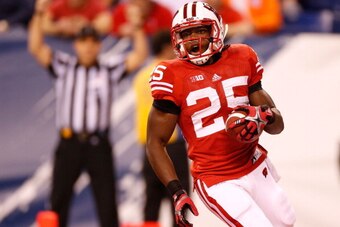 INDIANAPOLIS, IN - DECEMBER 01: Melvin Gordon #25 of the Wisconsin Badgers reacts after scoring a first quarter touchdown while playing the Nebraska Cornhuskers during the Big 10 Conference Championship Game at Lucas Oil Stadium on December 1, 2012 in Ind