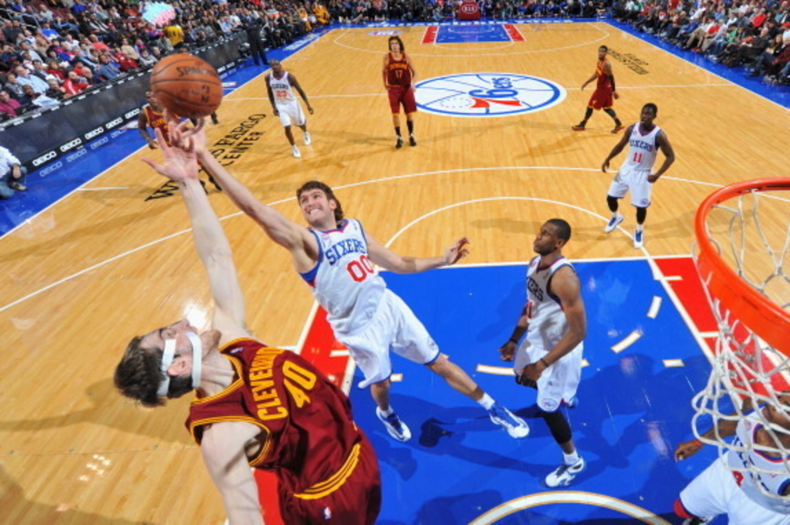 PHILADELPHIA, PA - NOVEMBER 18:  Spencer Hawes #00 of the Philadelphia 76ers fights for the rebound against Tyler Zeller #40 of the Cleveland Cavaliers at the Wells Fargo Center on November 18, 2012  in Philadelphia, Pennsylvania. NOTE TO USER: User expre