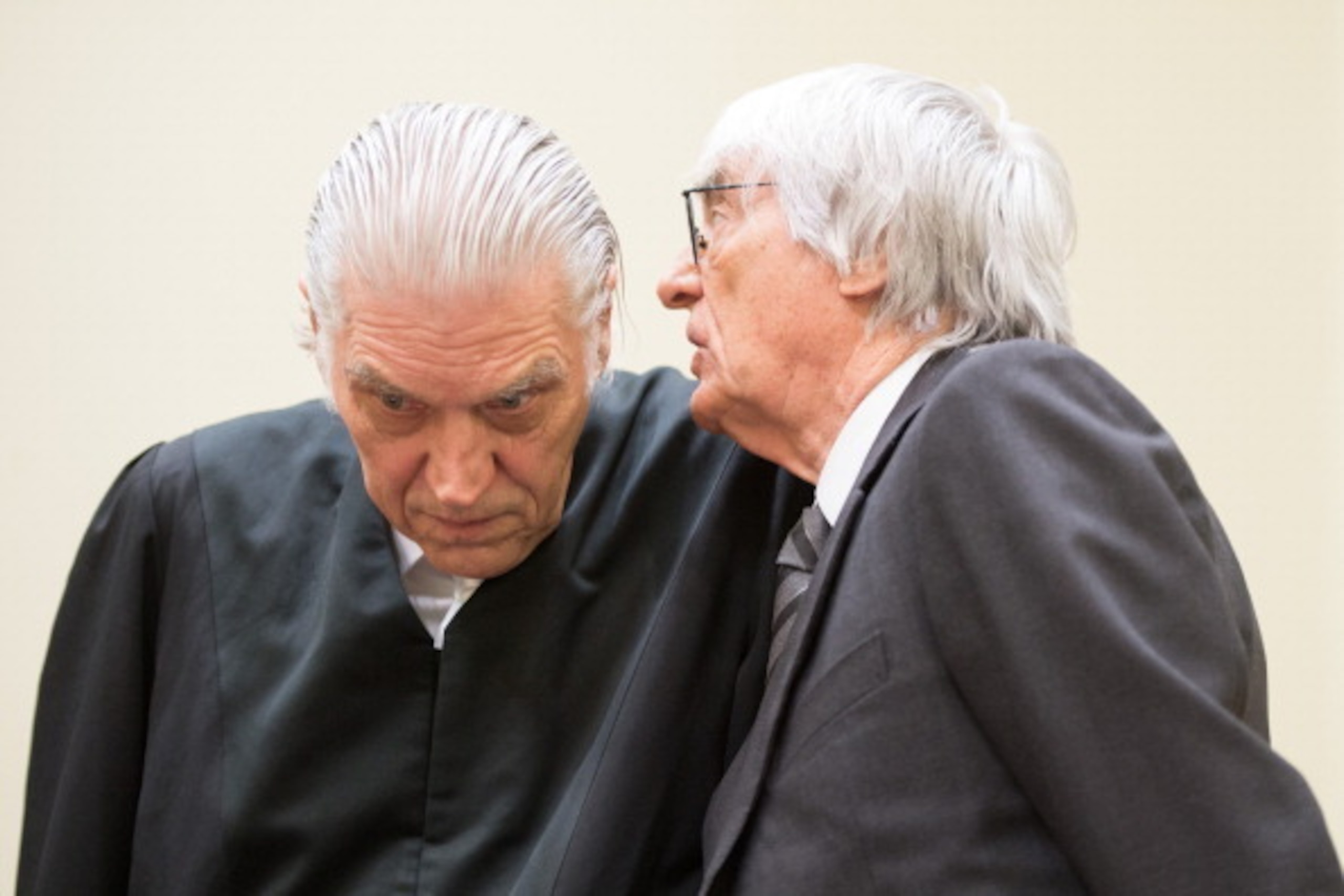 MUNICH, GERMANY - MAY 13: Bernie Ecclestone, the 83-year-old controlling business magnate of Formula One racing, attends his trial for bribery with his lawyer Sven Thomas (L), on May 13, 2014 in Munich, Germany. Ecclestone is accused of bribing BayernLB b