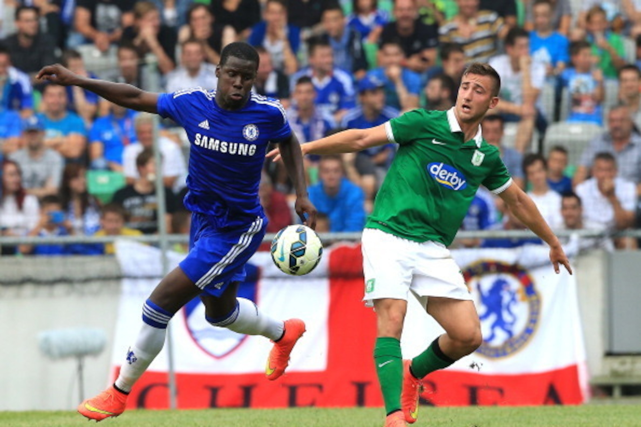 LJUBLJANA, SLOVENIA - JULY 27: Kurt Zouma (L) of Chelsea battle for the ball with Andraz Sporar  (R) of FC Olimpija Ljubljana during the Pre Season Friendly  match between FC Olimpija Ljubljana and Chelsea at Stozice stadium in Ljubljana, Slovenia on Sund