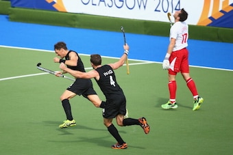 GLASGOW, SCOTLAND - JULY 29:  Simon Child of New Zealand celebrates after scoring a goal during the men's preliminaries match between New Zealand and England at the Glasgow National Hockey Centre during day six of the Glasgow 2014 Commonwealth Games on Ju
