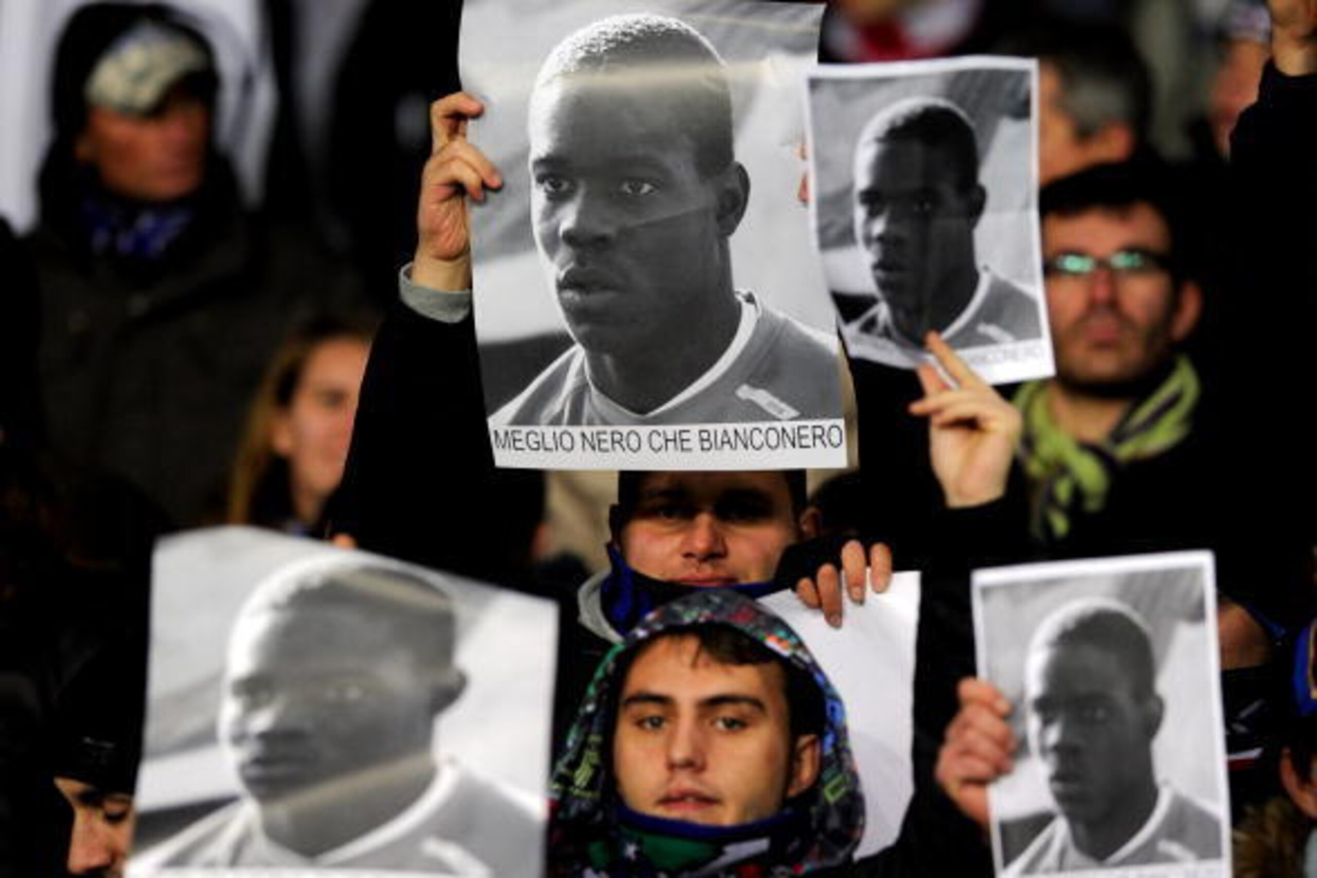 TURIN, ITALY - DECEMBER 05:  Supporters of FC Internazionale Milano hold up posters of Mario Balotelli in response to racist abuse that the player received during last season's fixture during the Serie A match between Juventus and Inter Milan at Stadio Ol