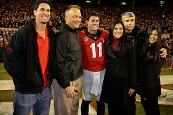 ATHENS, GA - NOVEMBER 23:  Quarterback Aaron Murray #11 of the Georgia Bulldogs poses with his family and Georgia head coach Mark Richt second from left) during Senior Day festivities before the game against the Kentucky Wildcats at Sanford Stadium on Nov
