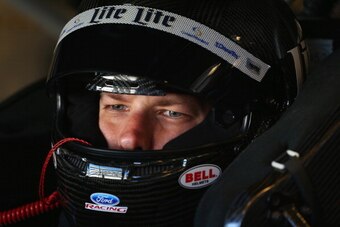 INDIANAPOLIS, IN - JULY 25:  Brad Keselowski, driver of the #2 Miller Lite Ford, sits in his car in the garage area during practice for the NASCAR Sprint Cup Series Crown Royal Presents, the John Wayne Walding 400 at The Brickyard at Indianapolis Motor Sp