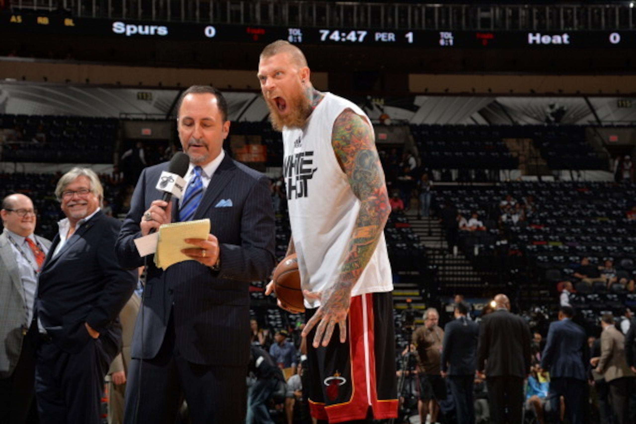 SAN ANTONIO, TX - JUNE 8: Chris Andersen #11 of the Miami Heat photobombs Eric Reid of NBA TV prior to the game against the San Antonio Spurs during Game Two of the 2014 NBA Finals on June 8, 2014 at AT&T Center in San Antonio, Texas. NOTE TO USER: User e