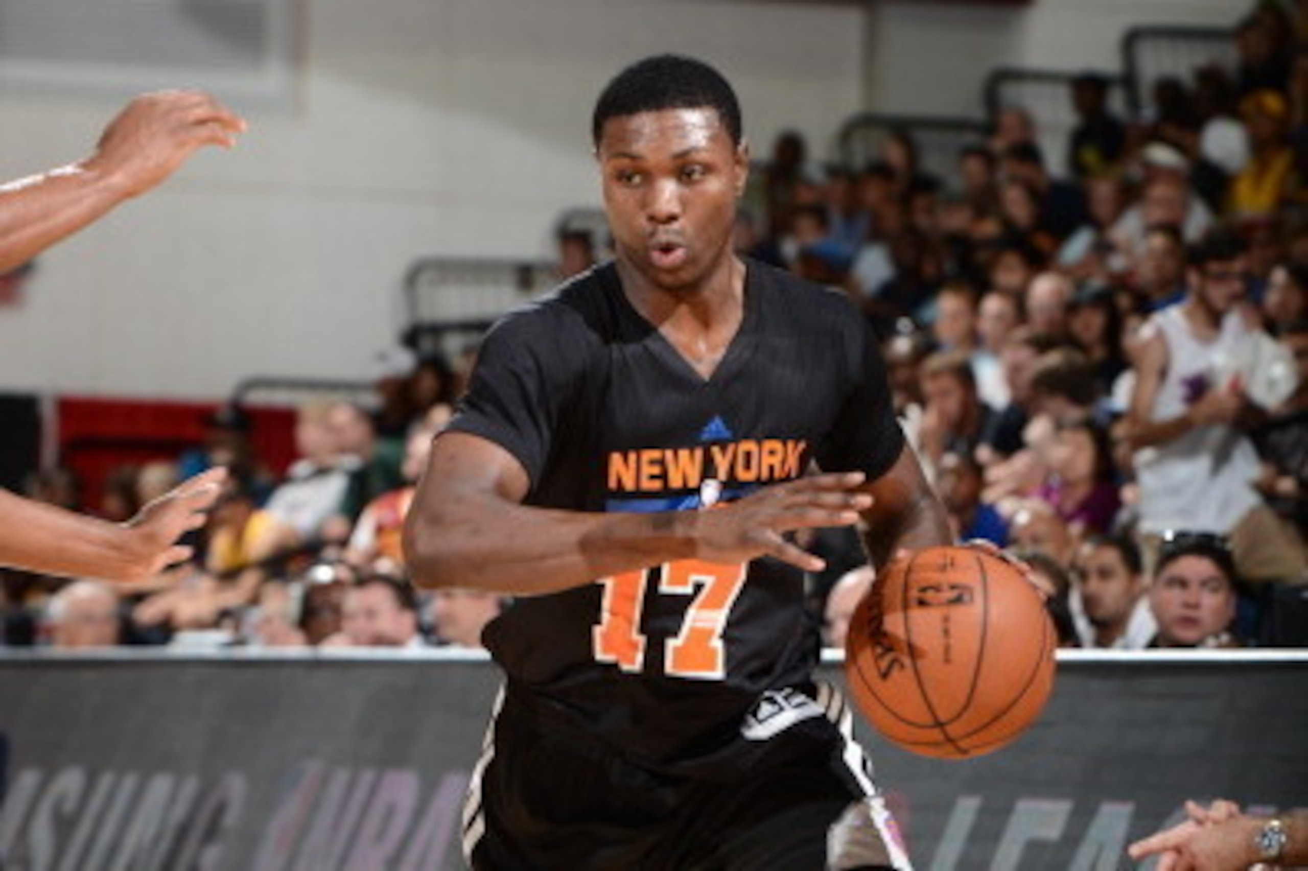 LAS VEGAS, NV - JULY 11: Cleanthony Early #17 of the New York Knicks dribbles the ball against the Dallas Mavericks at the Samsung NBA Summer League 2014 on July 11, 2014 at the Cox Pavilion in Las Vegas, Nevada. NOTE TO USER: User expressly acknowledges 