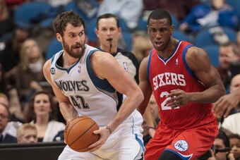 Dec 11, 2013; Minneapolis, MN, USA; Minnesota Timberwolves power forward Kevin Love (42) looks to pass in the second quarter against the Philadelphia 76ers power forward Thaddeus Young (21) at Target Center. Mandatory Credit: Brad Rempel-USA TODAY Sports