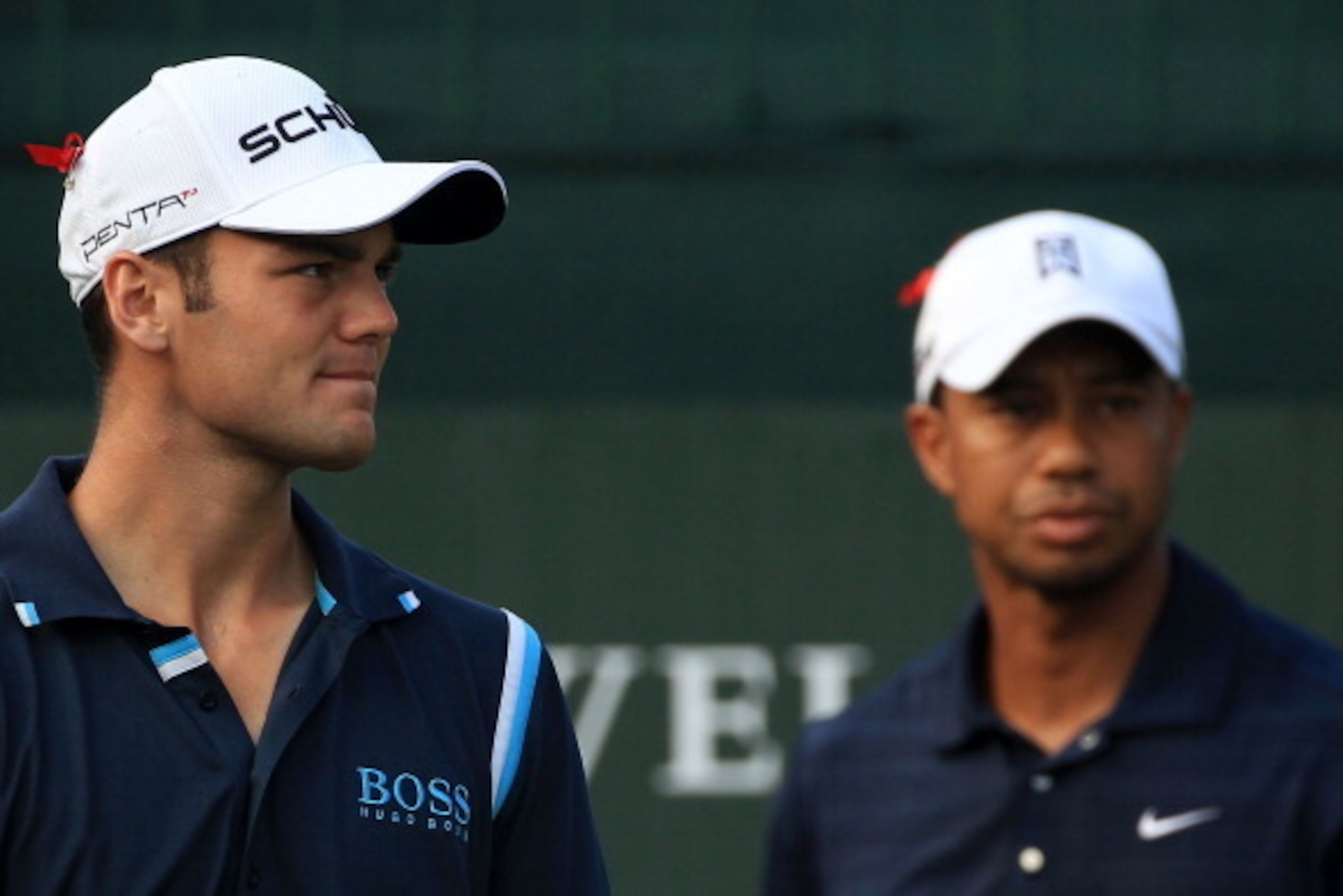 PONTE VEDRA BEACH, FL - MAY 12:  Martin Kaymer of Germany (L) and Tiger Woods (R) look on from the first hole tee box during the first round of THE PLAYERS Championship held at THE PLAYERS Stadium course at TPC Sawgrass on May 12, 2011 in Ponte Vedra Beac