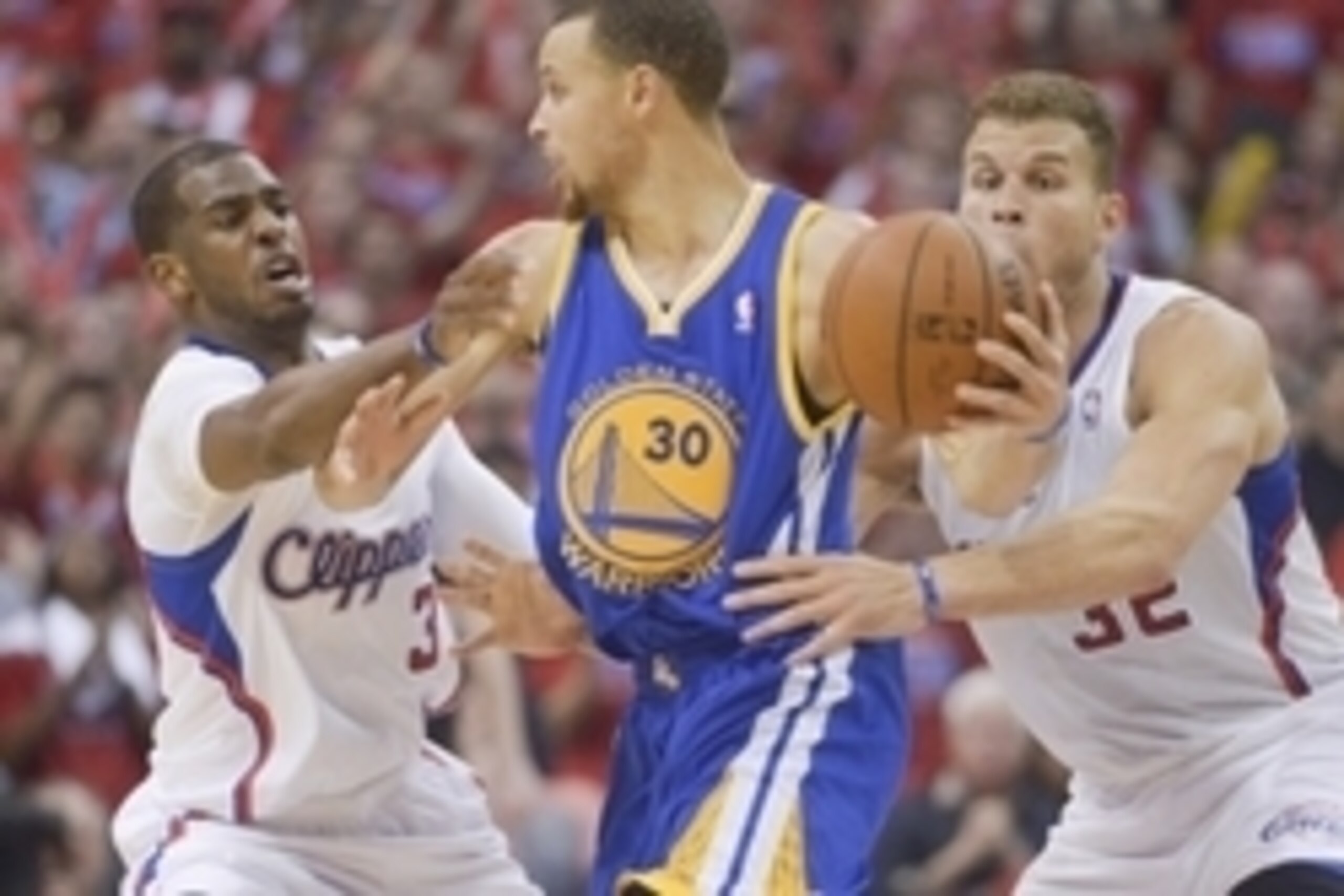 May 3, 2014; Los Angeles, CA, USA; Golden State Warriors guard Stephen Curry (30) is defended by Los Angeles Clippers guard Chris Paul (3) and forward Blake Griffin (32) during game seven of the first round of the 2014 NBA Playoffs at Staples Center. The 