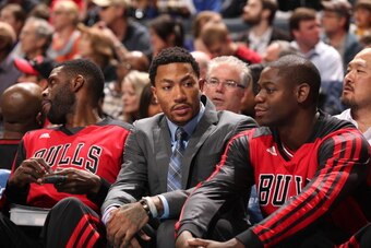 CHARLOTTE, NC - APRIL 16: Nazr Mohammed #48, Derrick Rose #1 and Ronnie Brewer #11 of the Chicago Bulls sit on the bench during the game against the Charlotte Bobcats at the Time Warner Cable Arena on April 16, 2014 in Charlotte, North Carolina. NOTE TO U