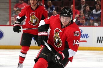 OTTAWA, ON - APRIL 12: Colin Greening #14 of the Ottawa Senators skates up ice with the puck against the Toronto Maple Leafs at Canadian Tire Centre on April 12, 2014 in Ottawa, Ontario, Canada.  (Photo by Andre Ringuette/NHLI via Getty Images)