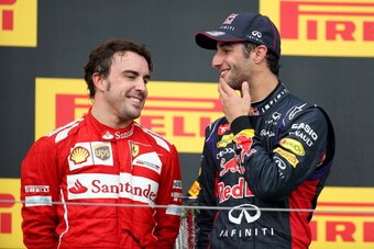 BUDAPEST, HUNGARY - JULY 27:  Daniel Ricciardo of Australia and Infiniti Red Bull Racing speaks with Fernando Alonso of Spain and Ferrari as he celebrates victory on the podium after the Hungarian Formula One Grand Prix at Hungaroring on July 27, 2014 in 