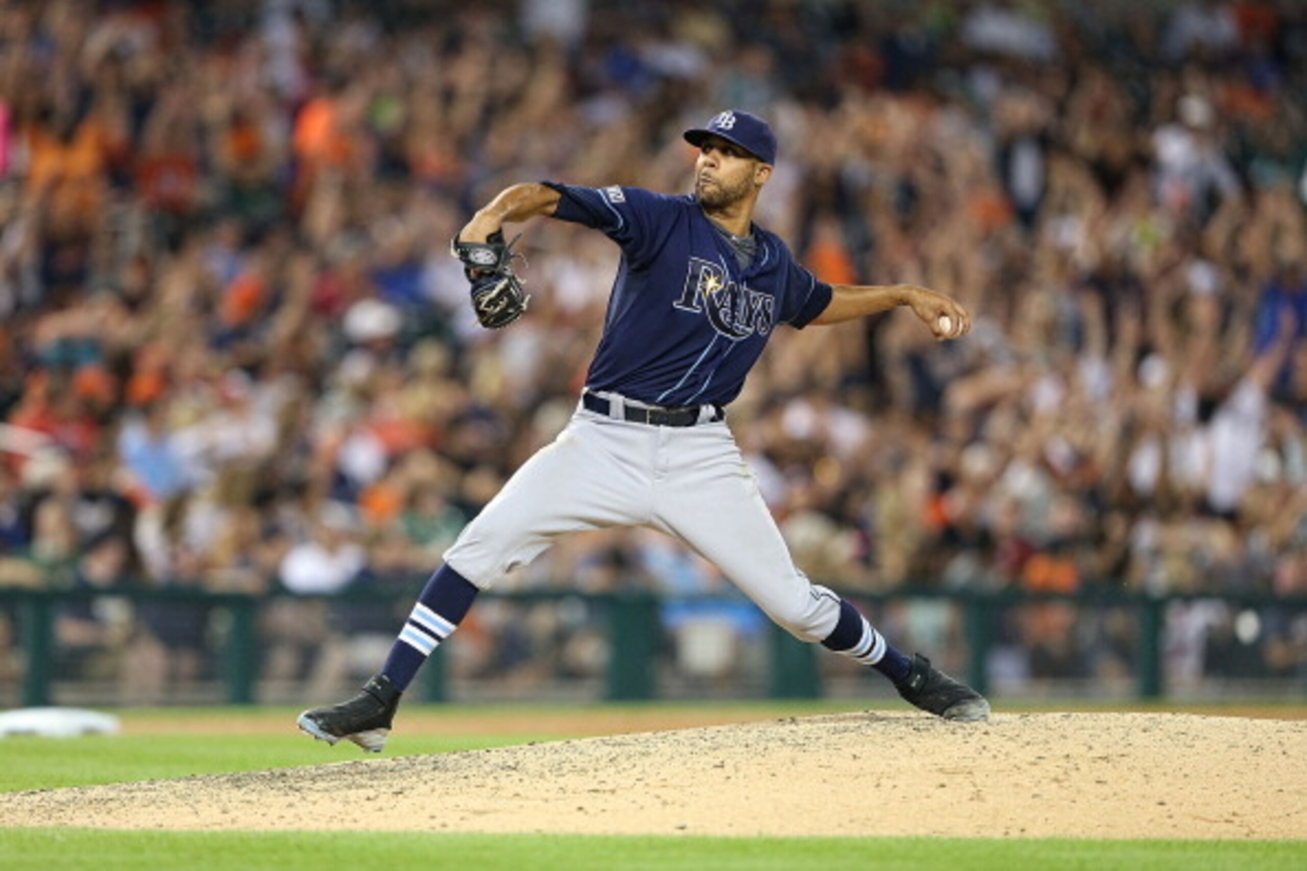 DETROIT, MI - JULY 06:  David Price #14 of the Tampa Bay Rays pitches in the eight inning of the game against the in Detroit Tigers with manager Joe Maddon #70 at Comerica Park on July 6, 2014 in Detroit, Michigan. Tampa Bay defeated Detroit 7-3.  (Photo 