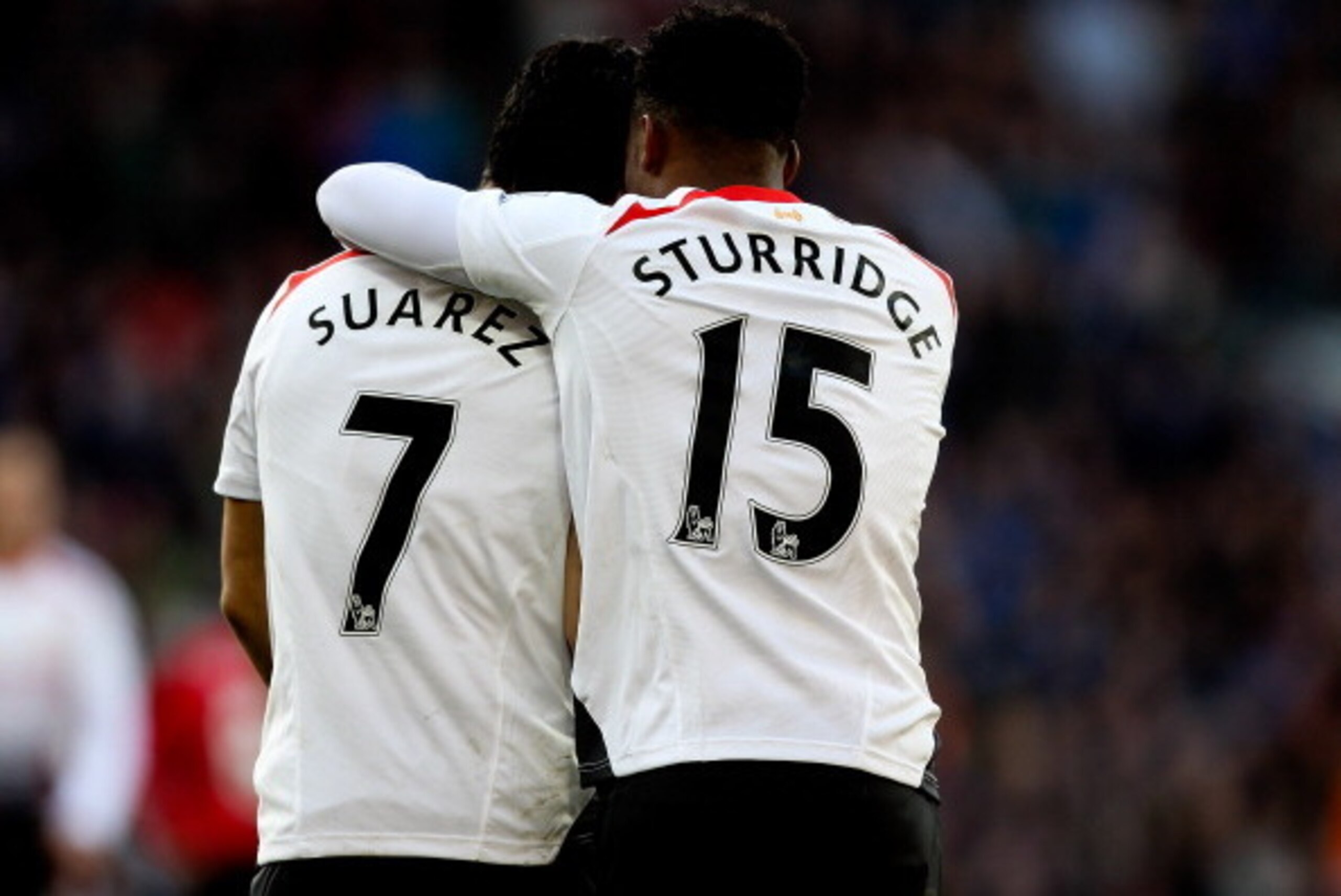 CARDIFF, WALES - MARCH 22:  Daniel Sturridge of Liverpool celebrates with team mate Luis Suarez after scoring his team's fifth goal during the Barclays Premier League match between Cardiff City and Liverpool at Cardiff City Stadium on March 22, 2014 in Ca