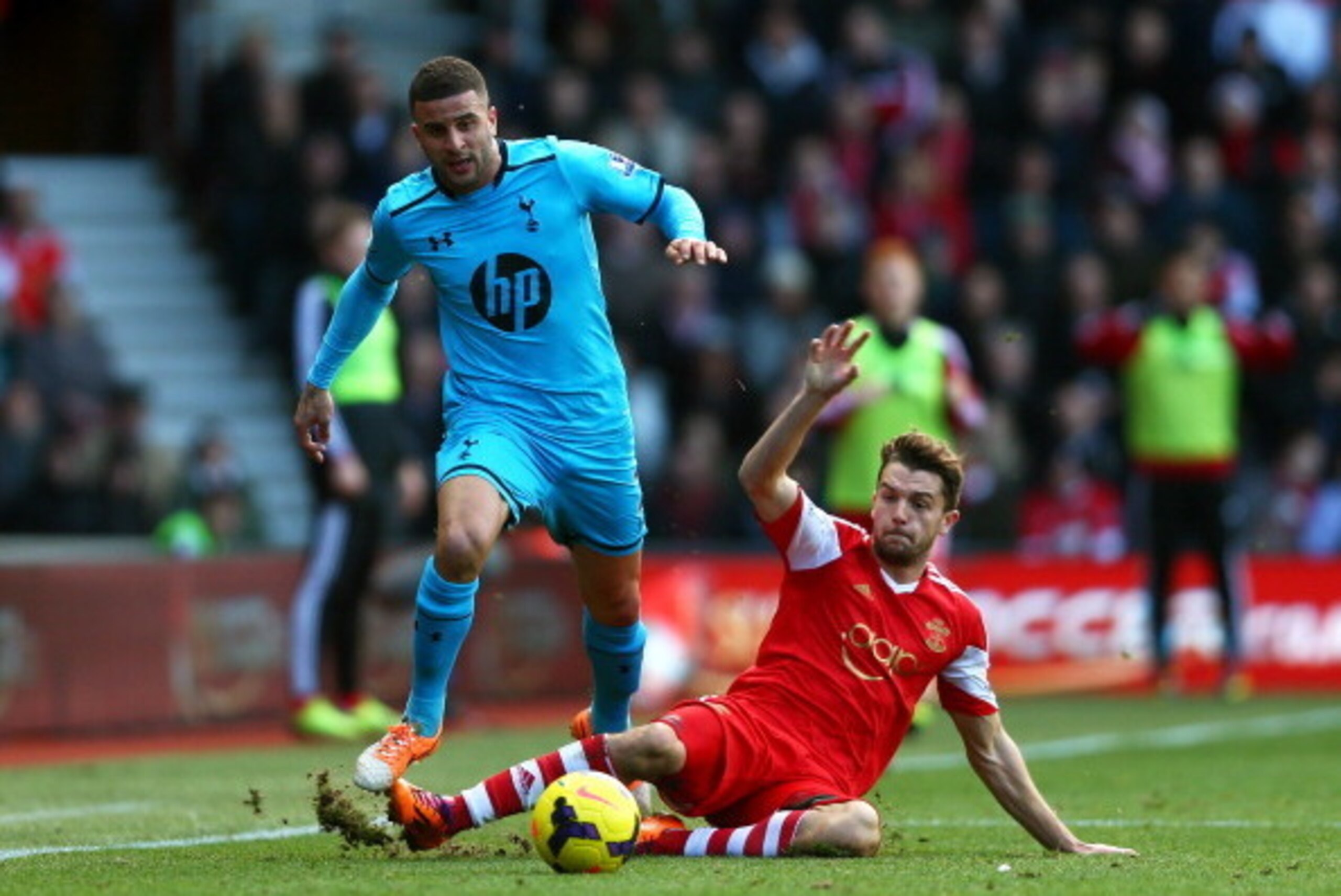 SOUTHAMPTON, ENGLAND - DECEMBER 22:  Kyle Walker of Spurs is tackled by Morgan Schneiderlin of Southampton during the Barclays Premier League match between Southampton and Tottenham Hotspur at St Mary's Stadium on December 22, 2013 in Southampton, England